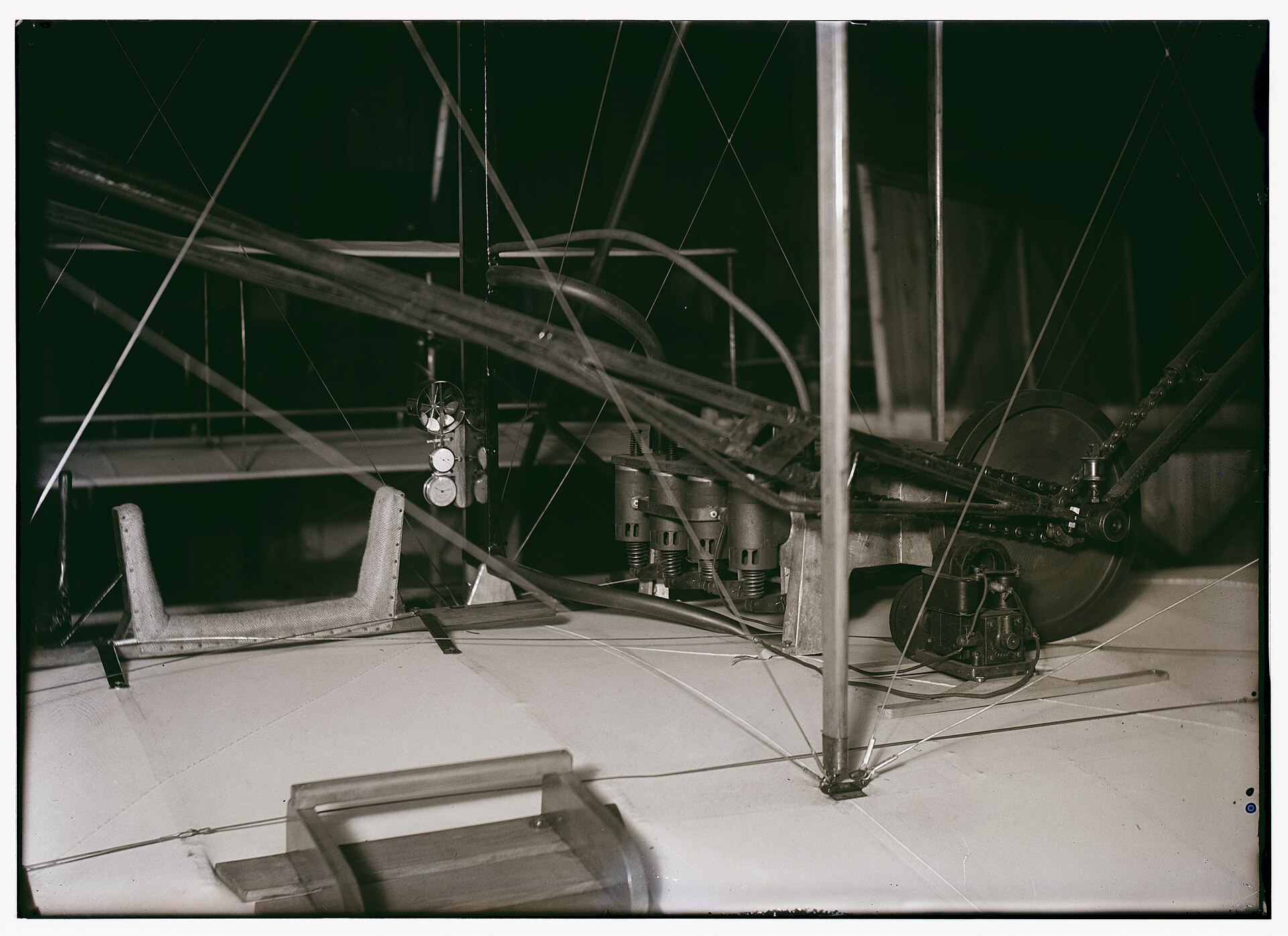 Close view of the 1903 Wright Flyer pilot position and engine with chain drive to the propellers
