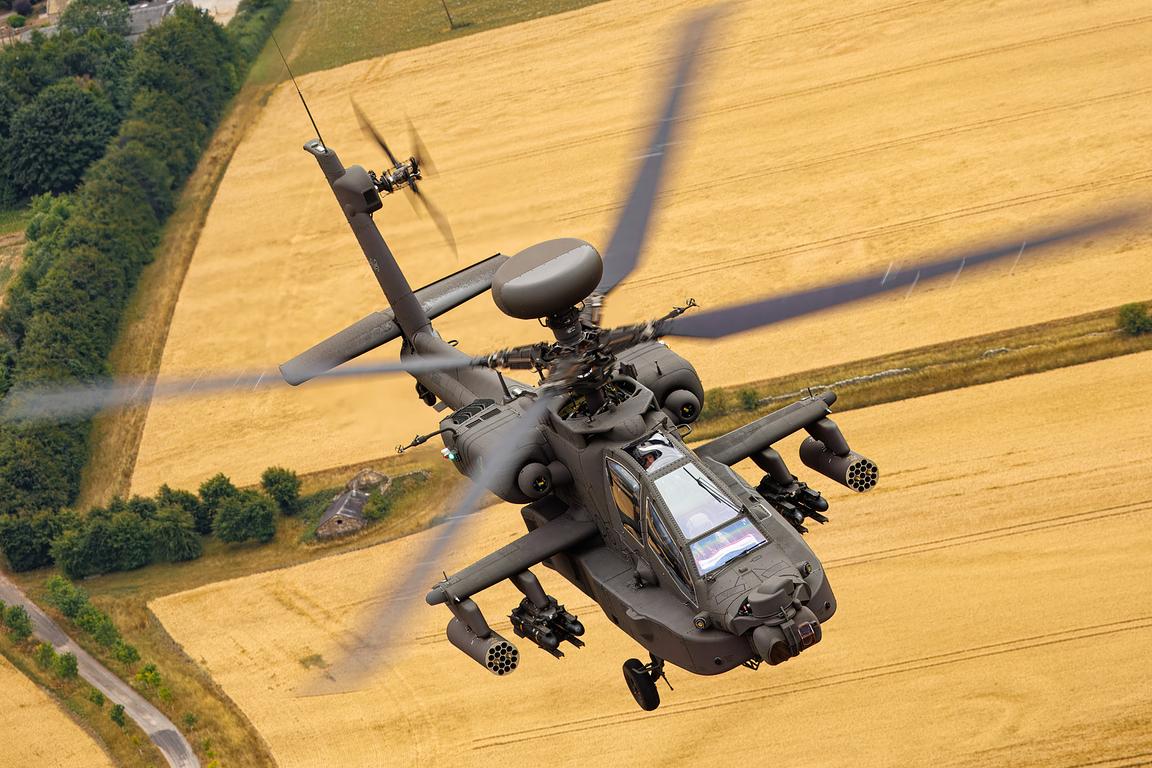 AH-64 Apache head on showing rocket pods and sensors, air to air