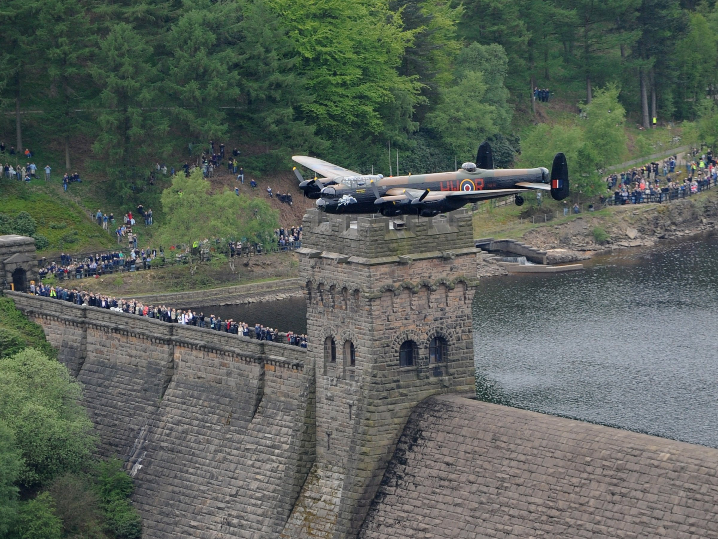 The Battle of Britain Memorial Flight Lancaster over the Derwent dam during an anniversary flypast