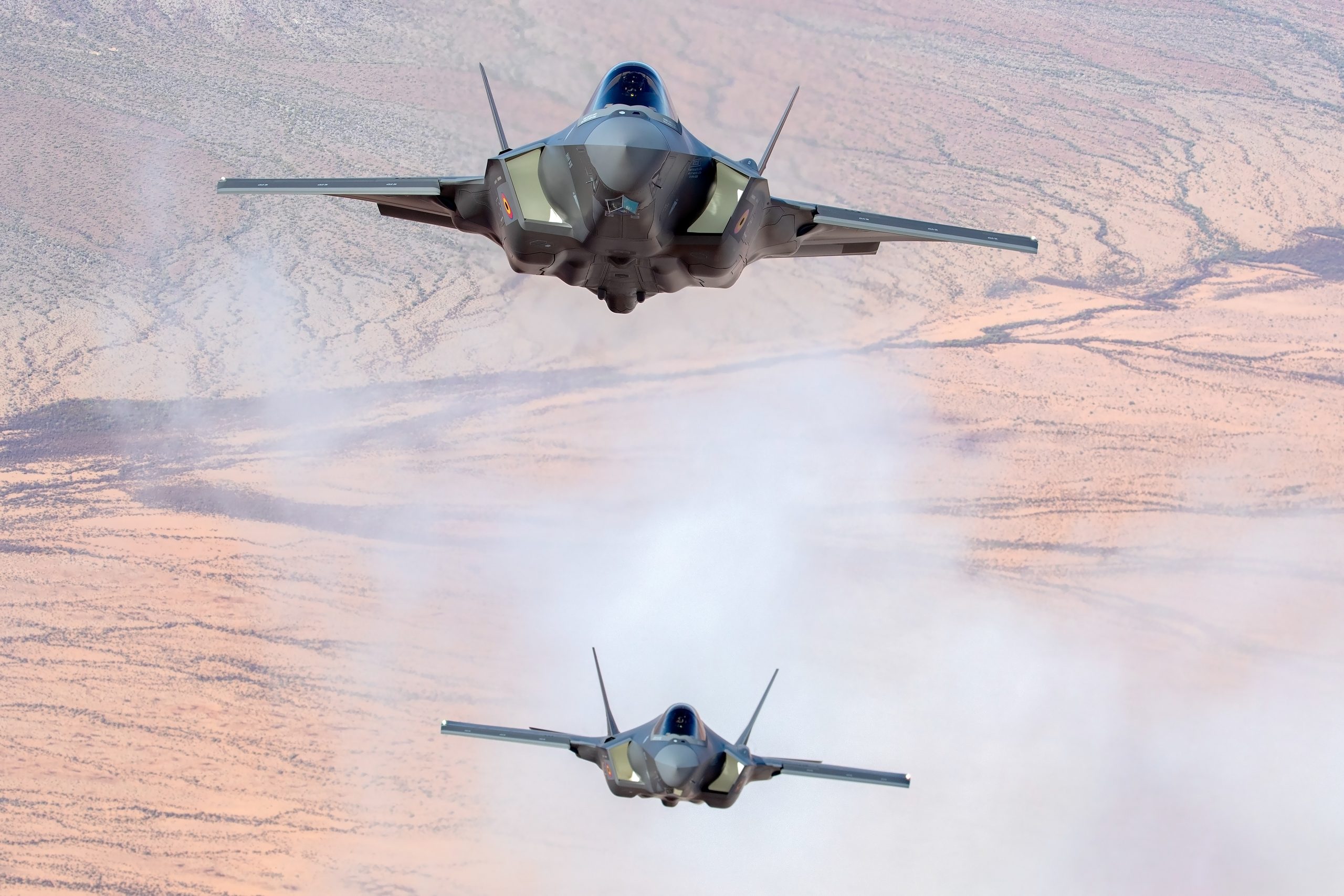 Two Belgian Air Force F-35A Lightning IIs over the Arizona desert, air to air