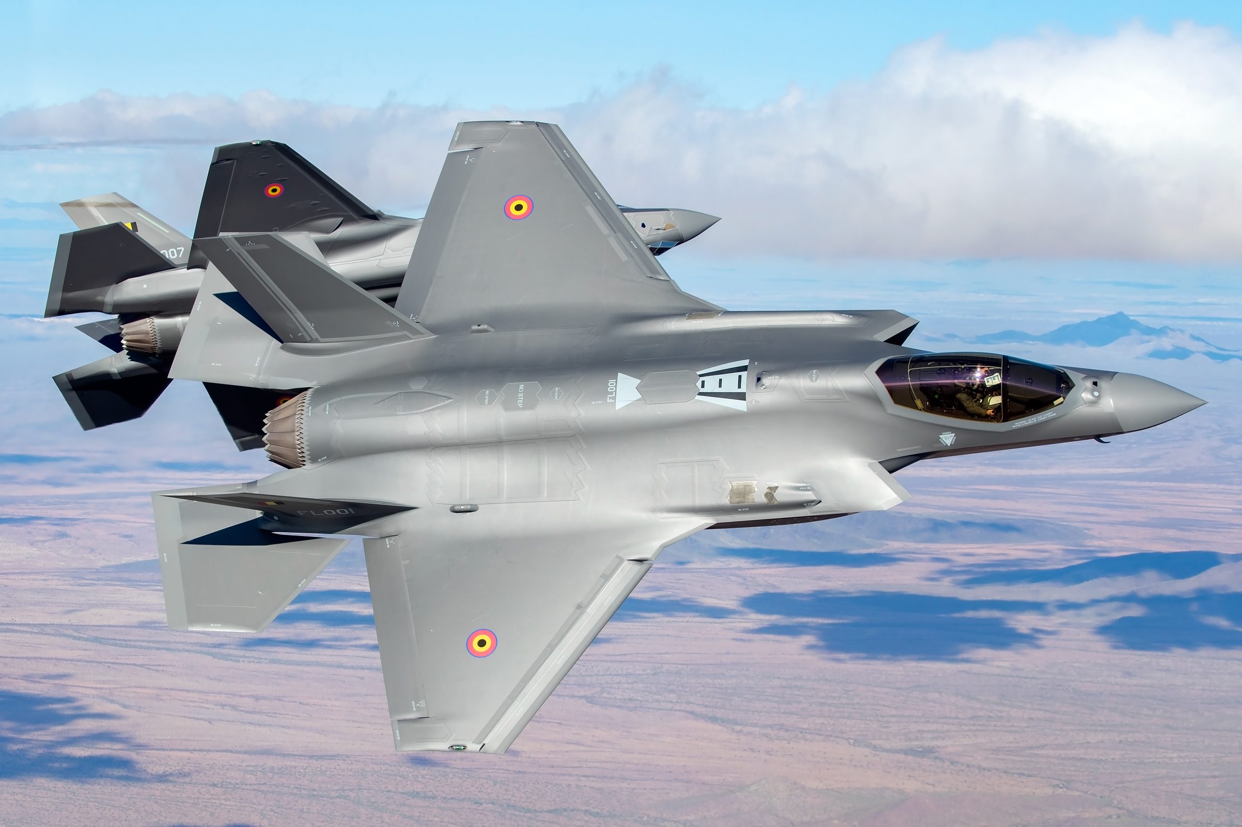 Two Belgian Air Force F-35A Lightning IIs topside in close formation, air to air