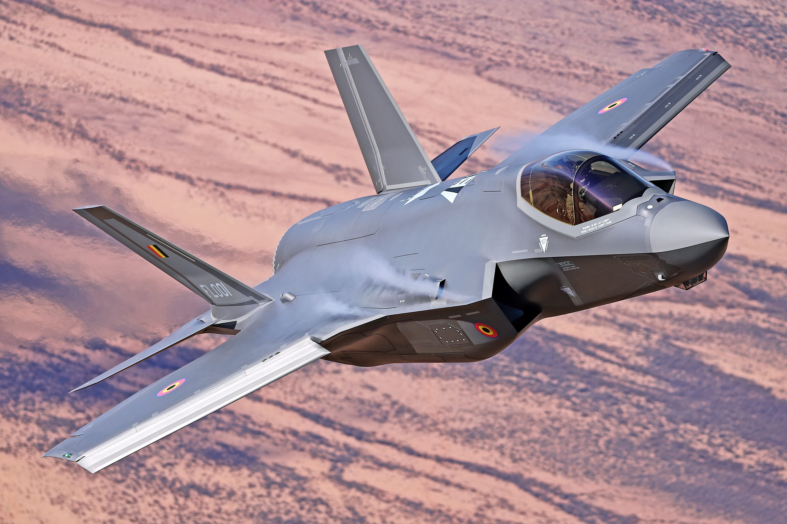 Belgian Air Force F-35A Lightning II rear quarter in dusk light, air to air