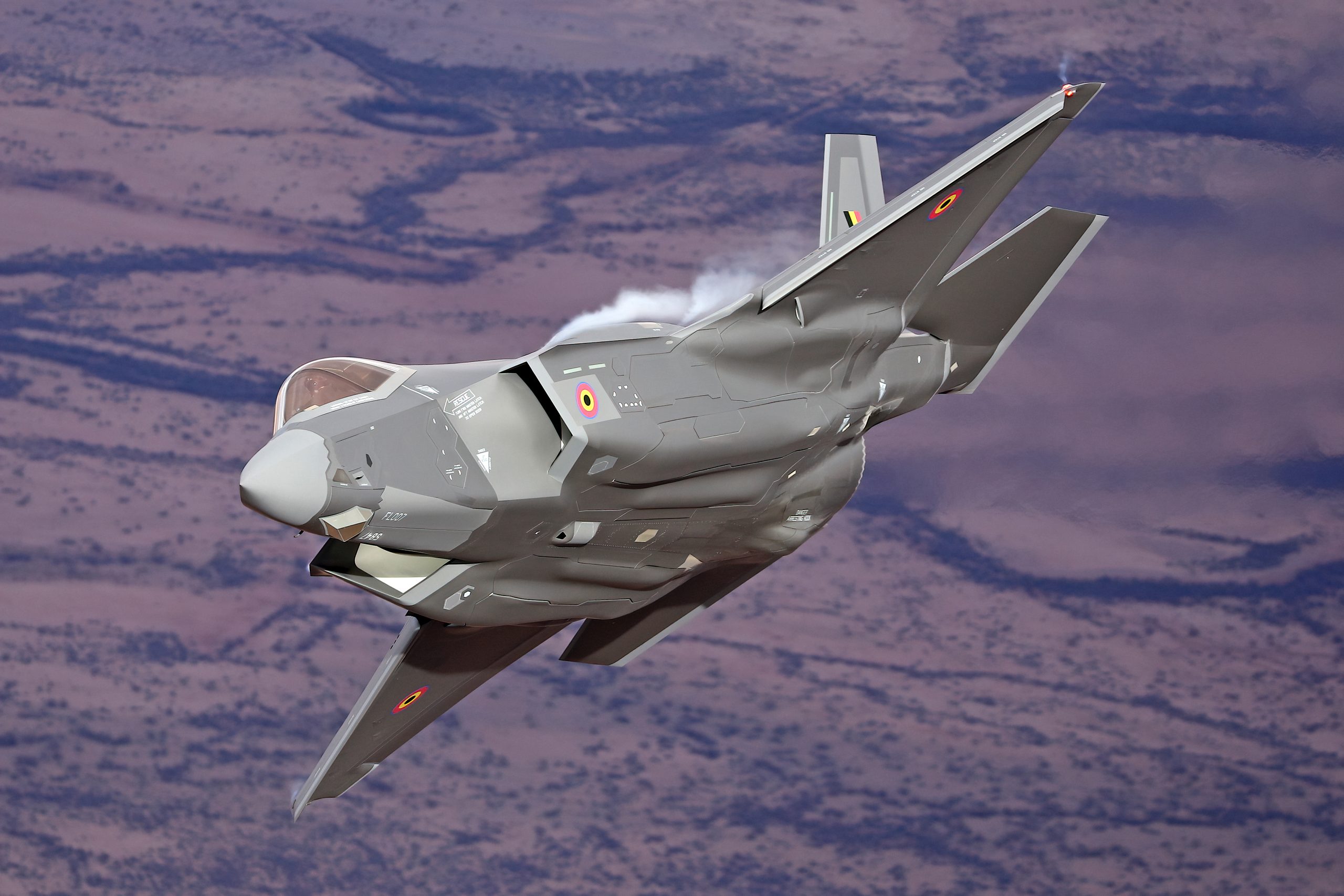 Belgian Air Force F-35A Lightning II topside at dusk, air to air