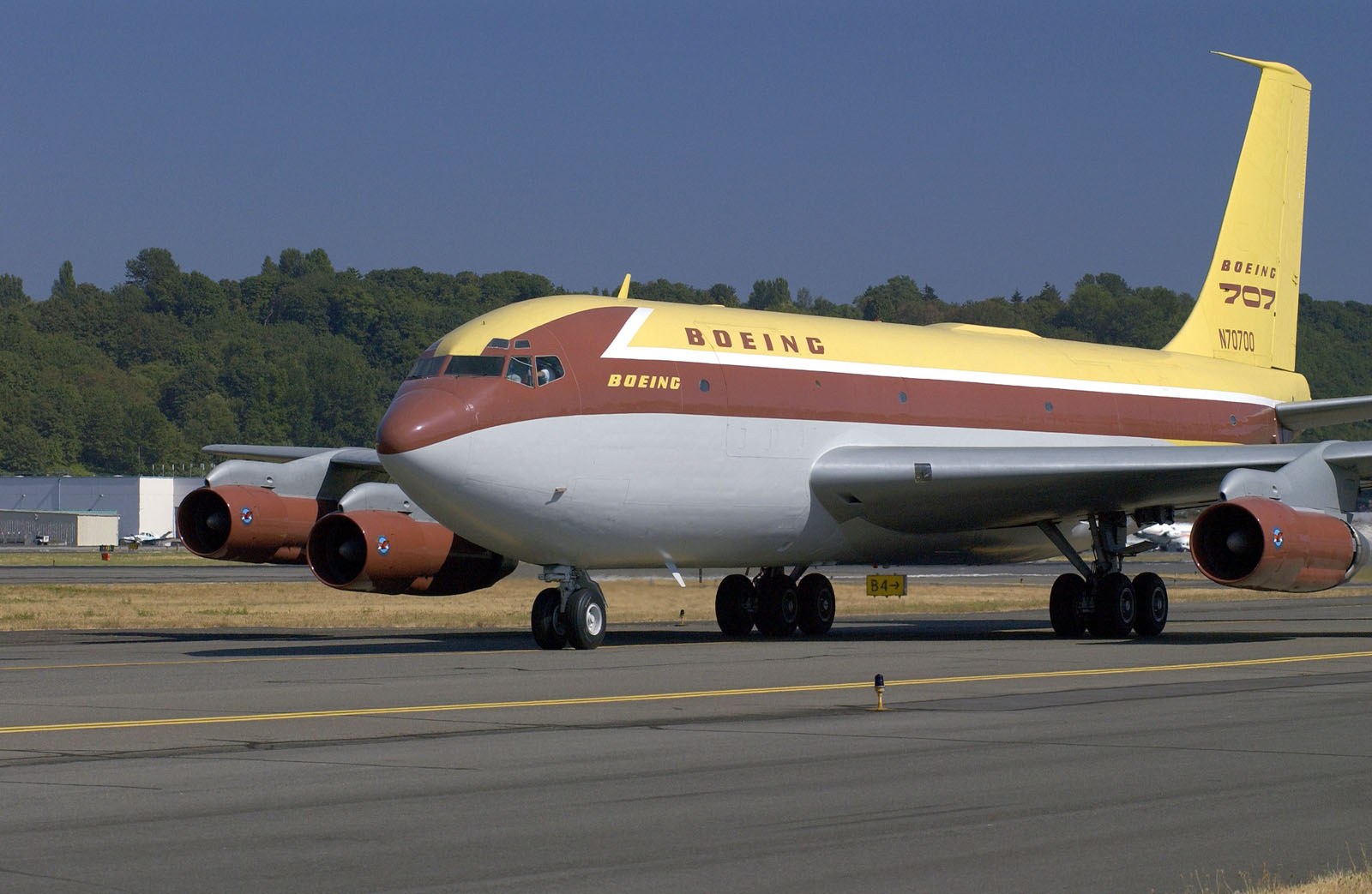 Boeing 367-80 prototype in its yellow and brown house colours taxiing at Boeing Field