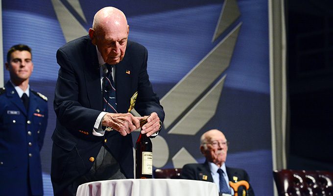 Dick Cole opens the 1896 Hennessy cognac at the Doolittle Raiders final toast, 2013