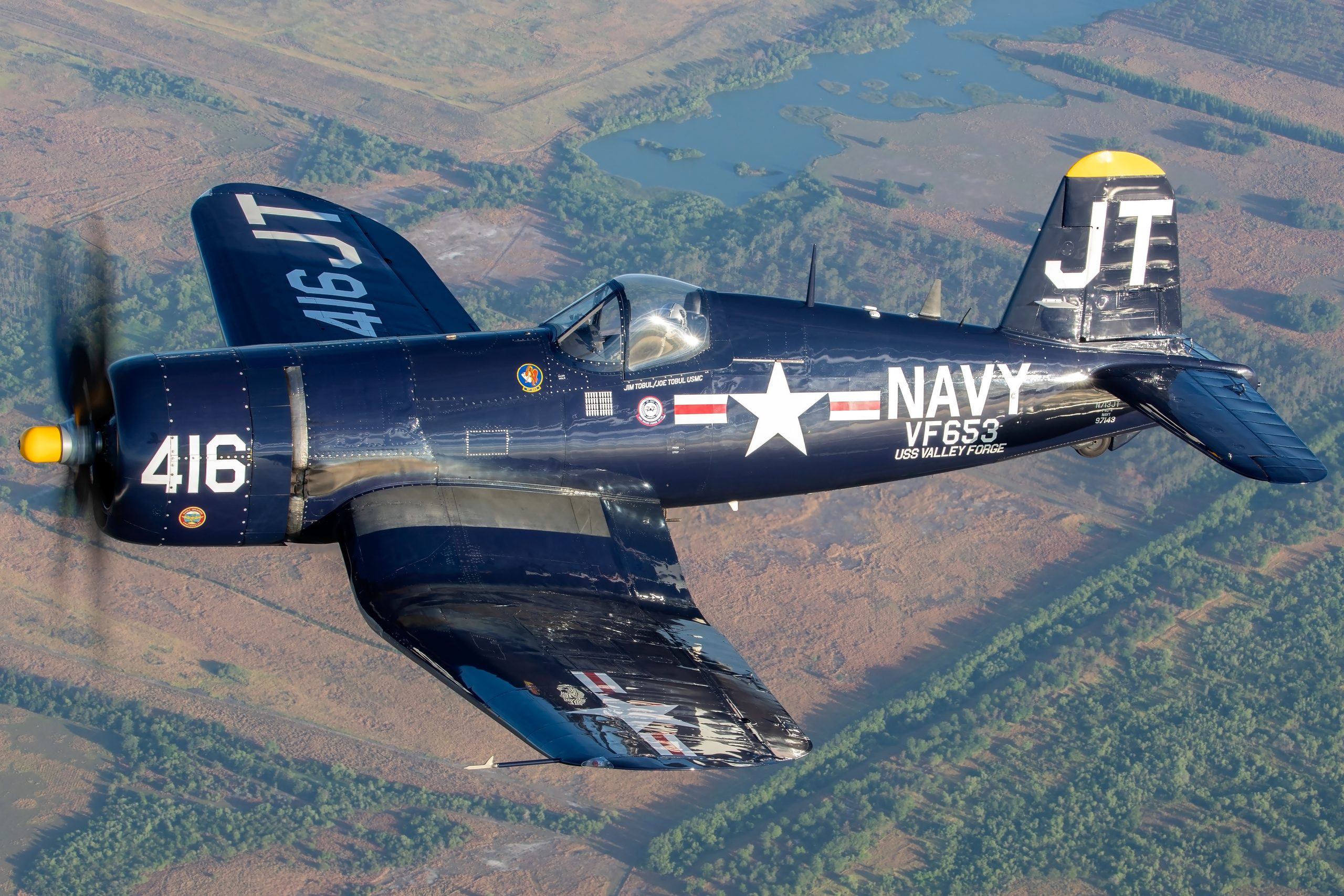 Vought F4U-4 Corsair 416 JT front quarter over Florida lakes, air to air