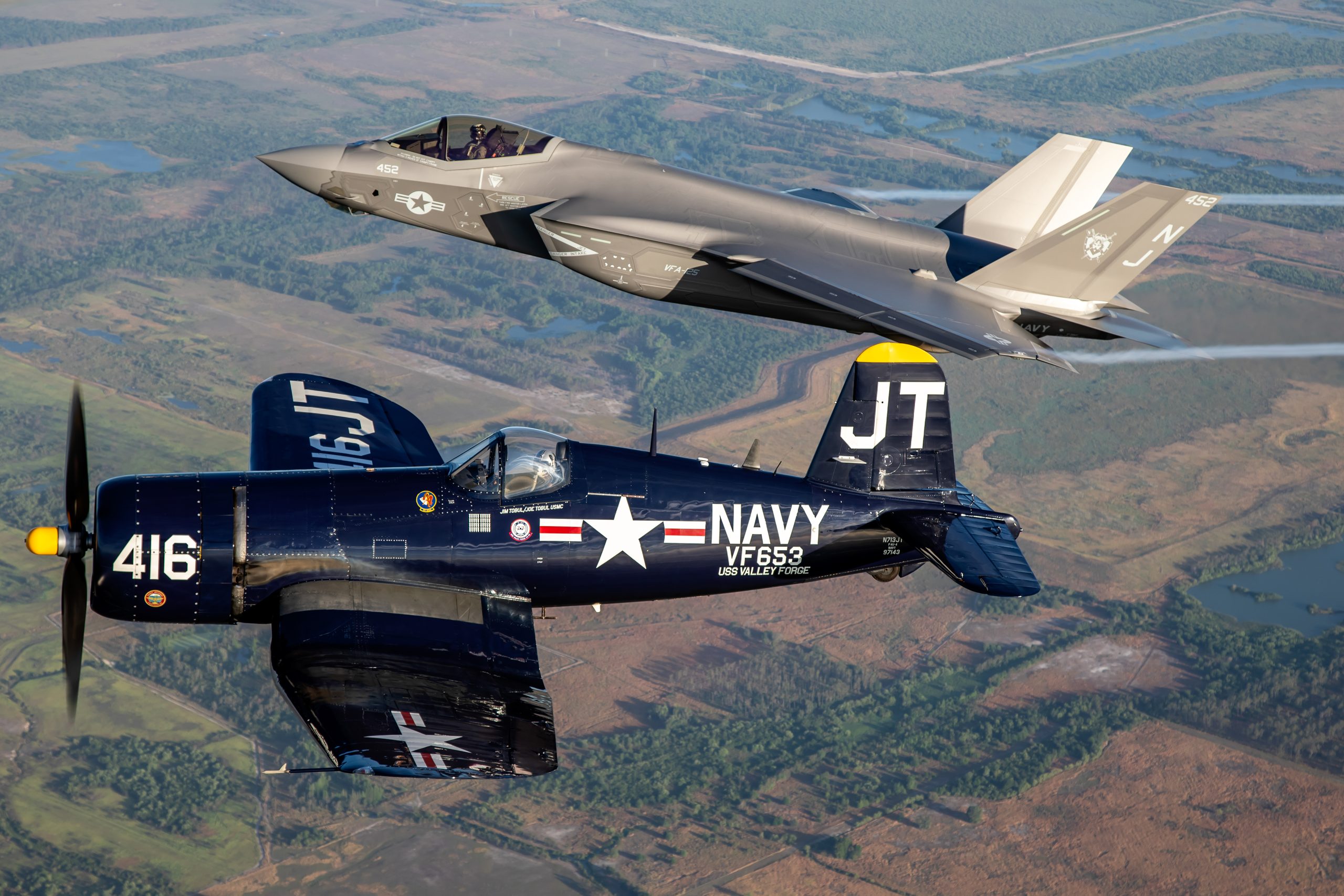 Vought F4U-4 Corsair in formation with a US Navy F-35C Lightning II, air to air