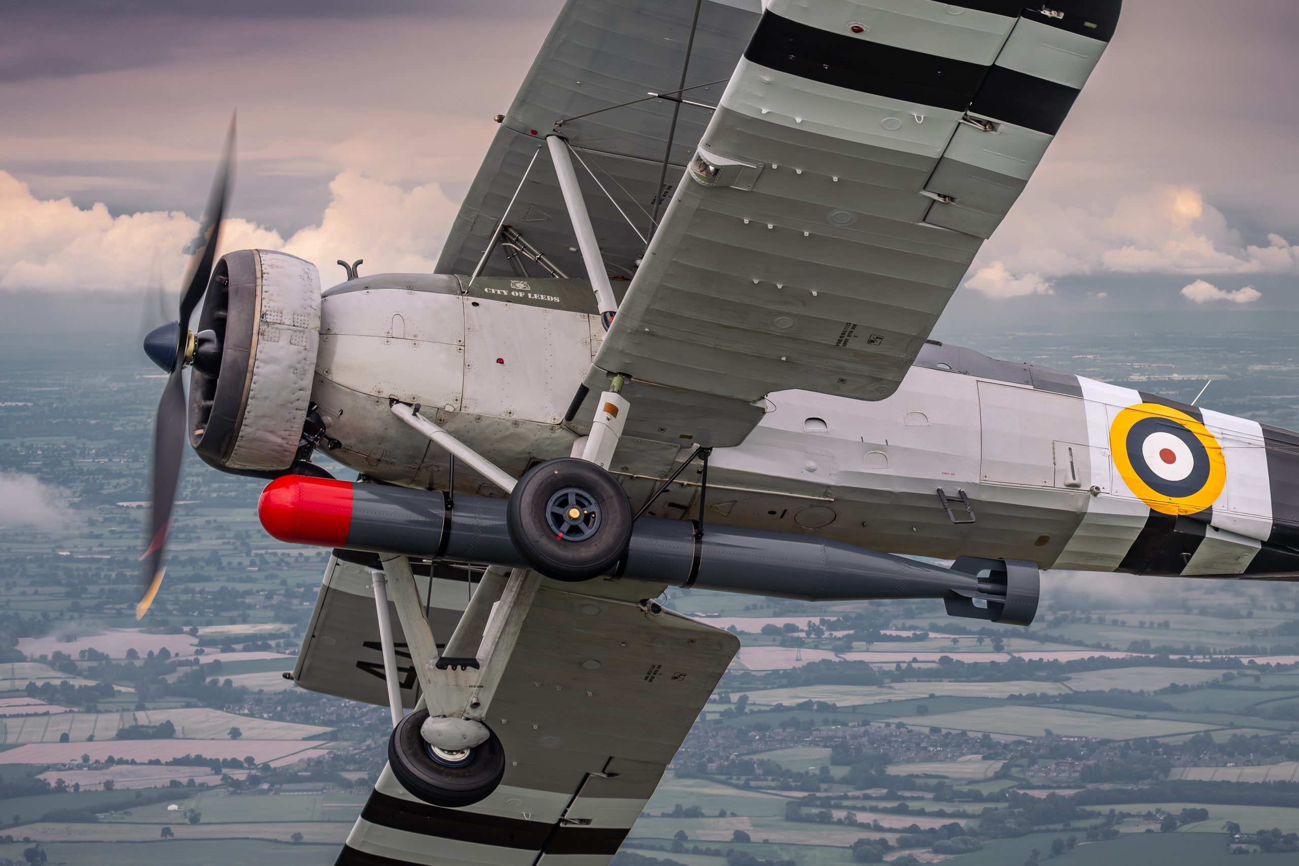Fairey Swordfish W5856 banking to show its underside and practice torpedo, air to air