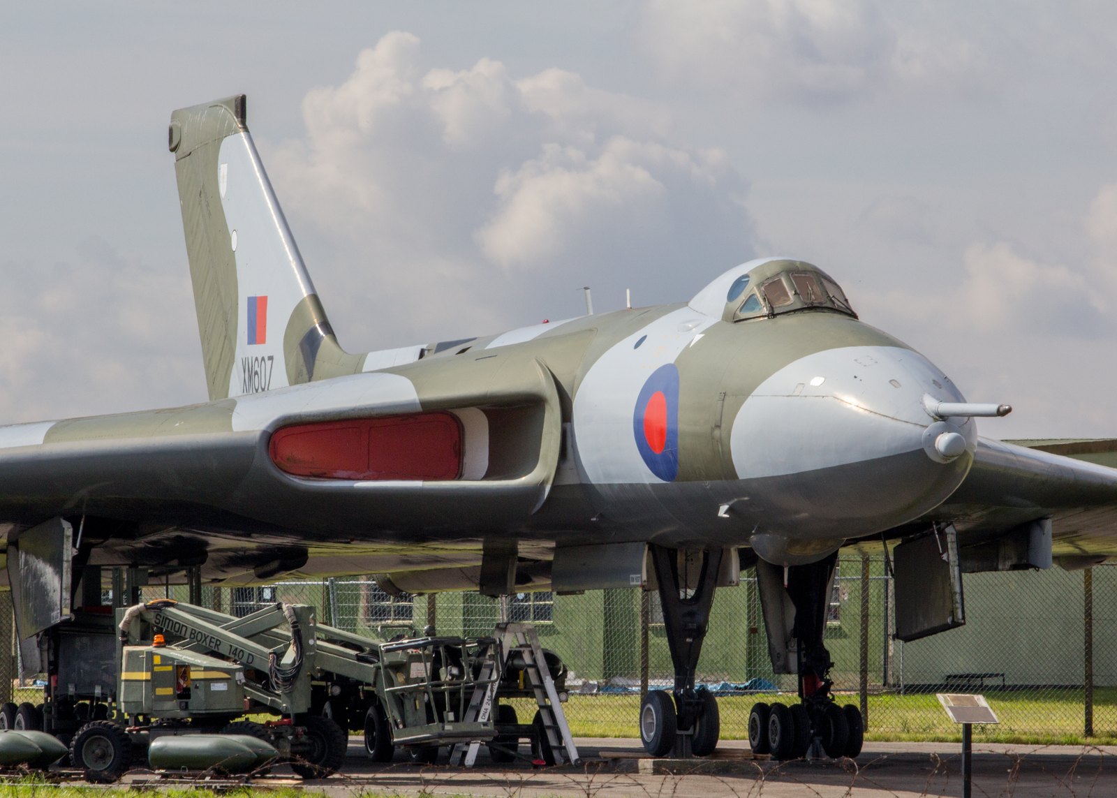 Avro Vulcan B2 XM607 preserved on hard standing at RAF Waddington, serial visible on the fin, ground equipment beneath the nose