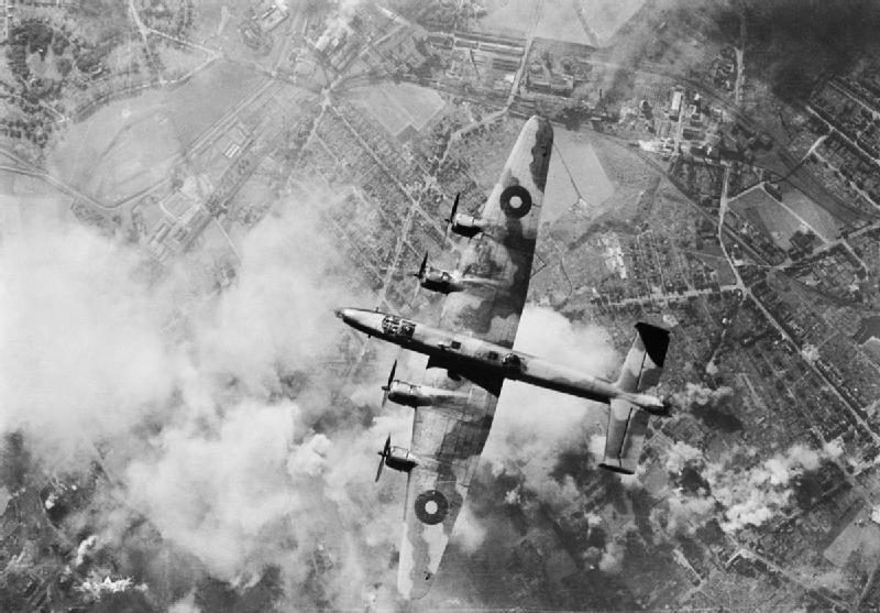 A Handley Page Halifax of RAF Bomber Command over the Wanne-Eickel oil refinery during a daylight raid, 12 October 1944