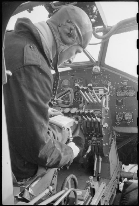 Worker fitting out the cockpit of a Handley Page Halifax on a British production line in 1942