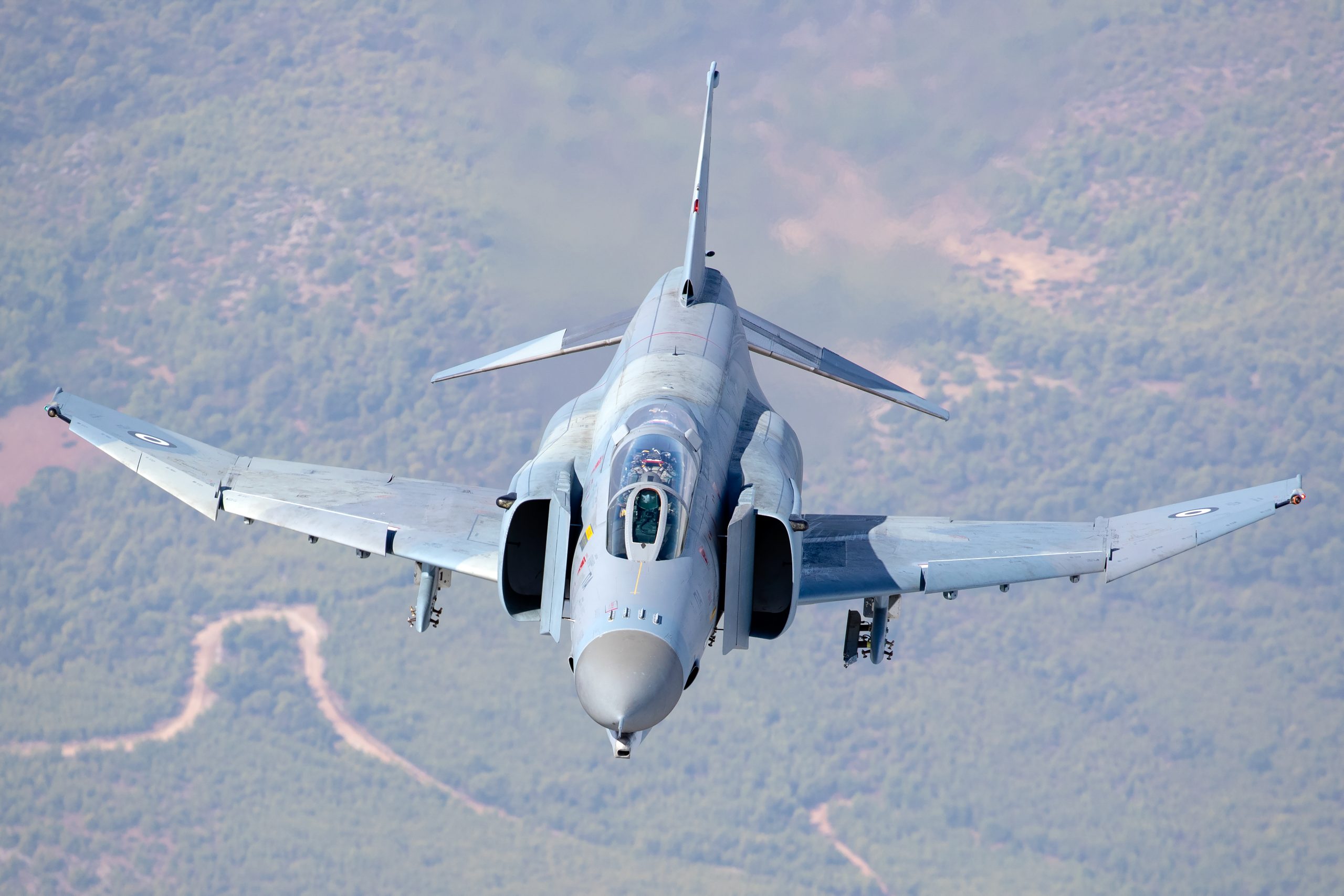 Hellenic Air Force F-4E AUP Phantom II 01518 head on through cloud with underwing stores, air to air