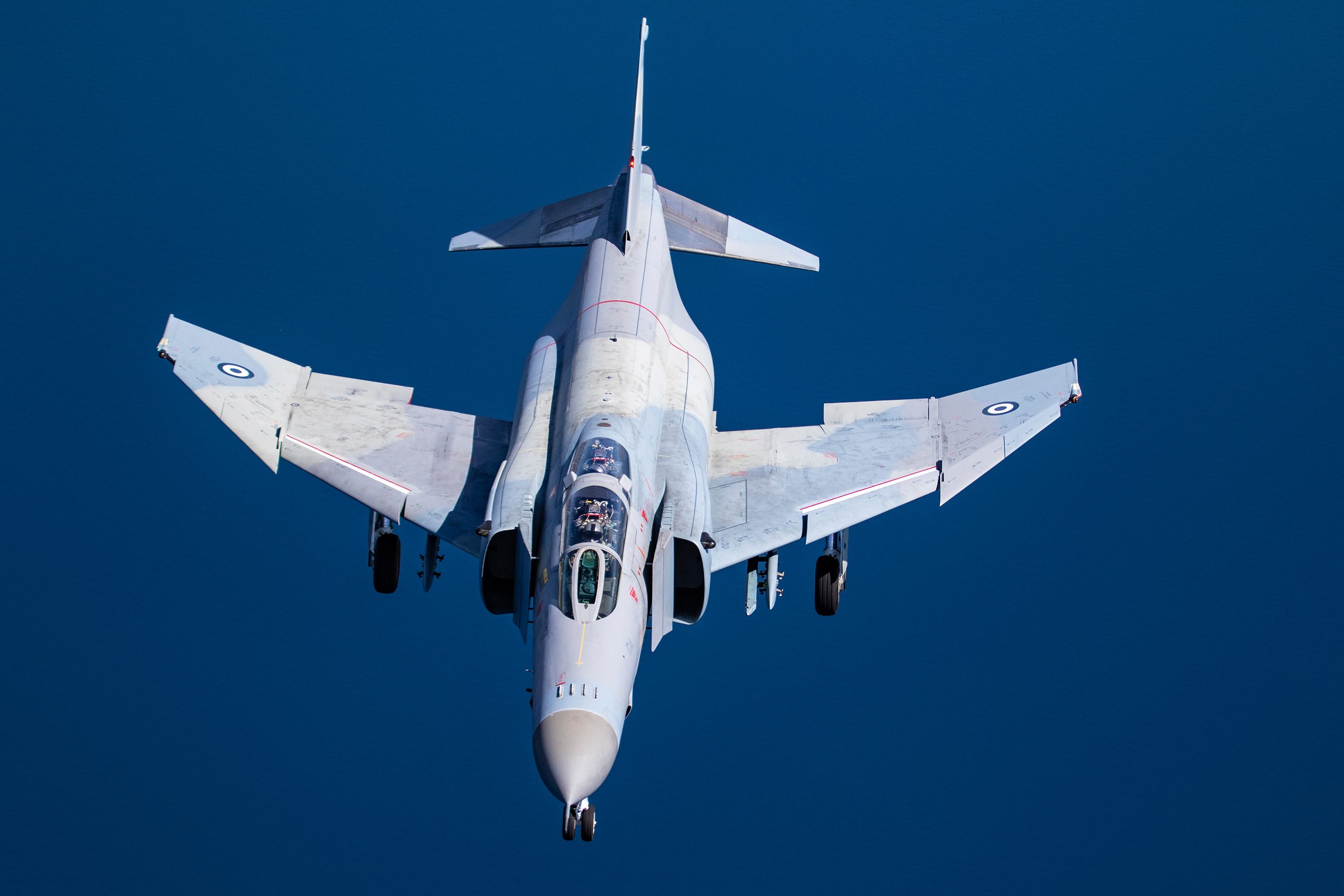 Hellenic Air Force F-4E AUP Phantom II 01518 from above with landing gear down against deep blue, air to air
