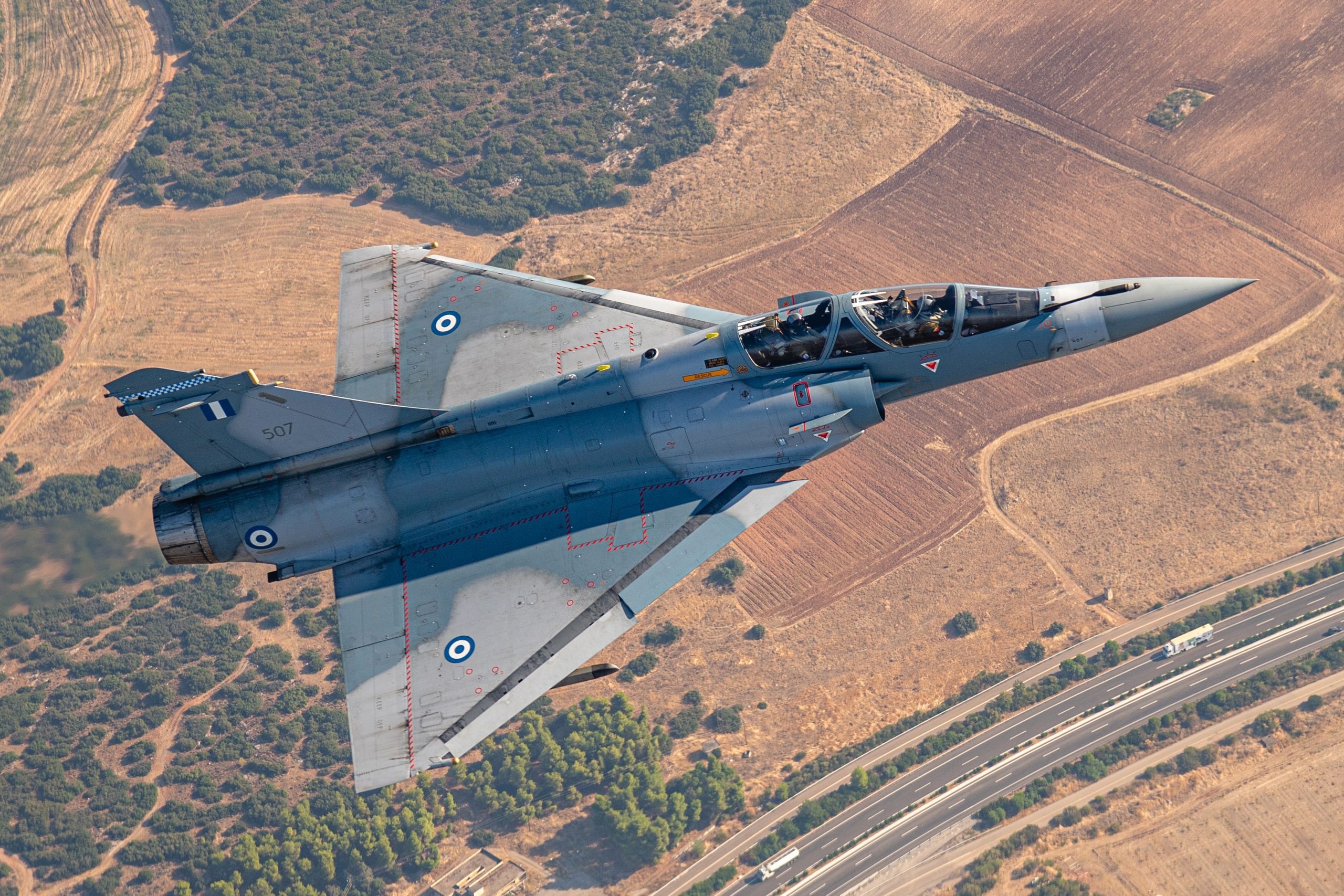 Hellenic Air Force Mirage 2000-5BG topside over Greek farmland, air to air