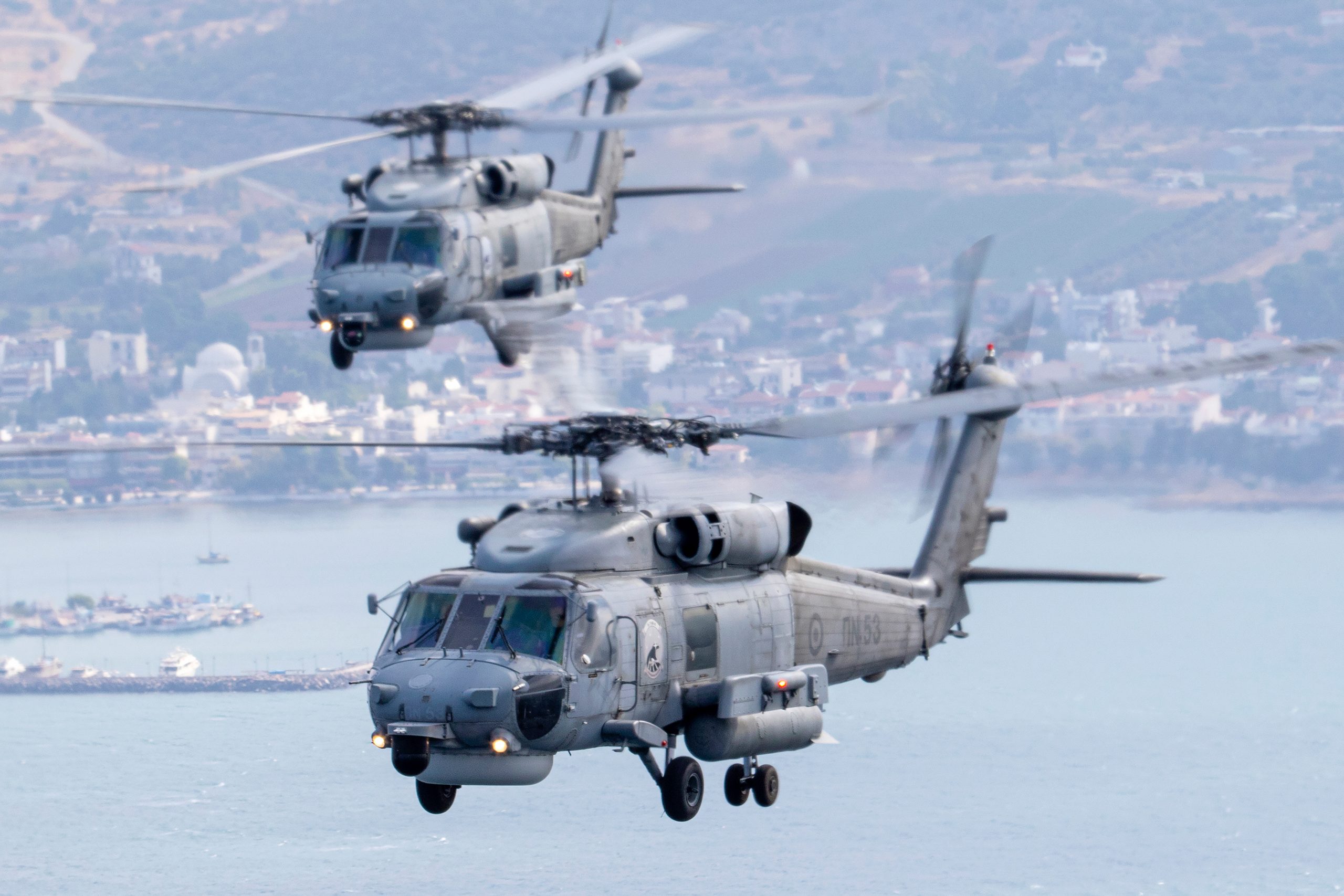 Two Hellenic Navy S-70B-6 Aegean Hawk helicopters over the Athens coast, air to air