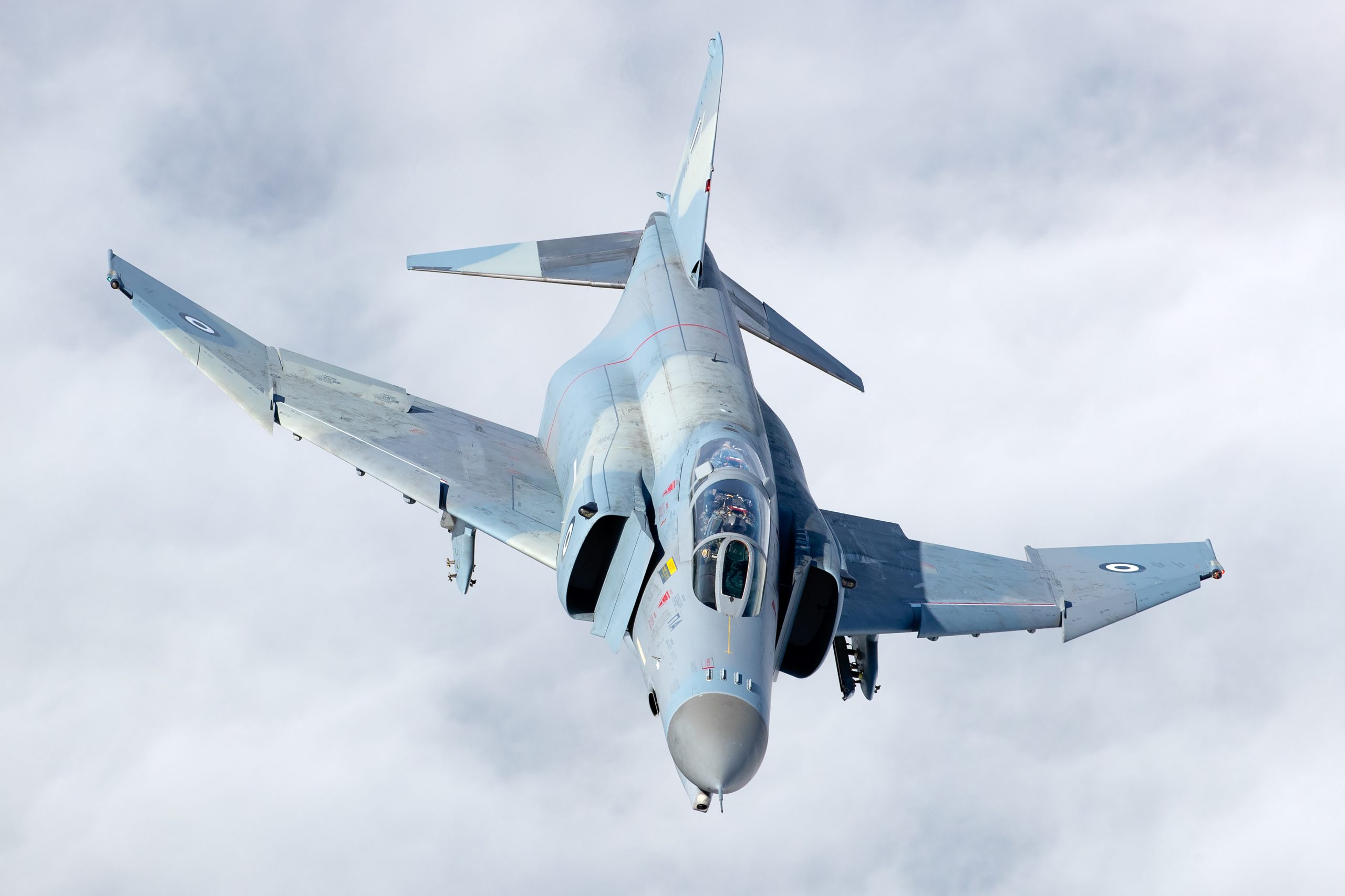 Hellenic F-4E AUP Phantom II 01518 banking through cloud, air to air