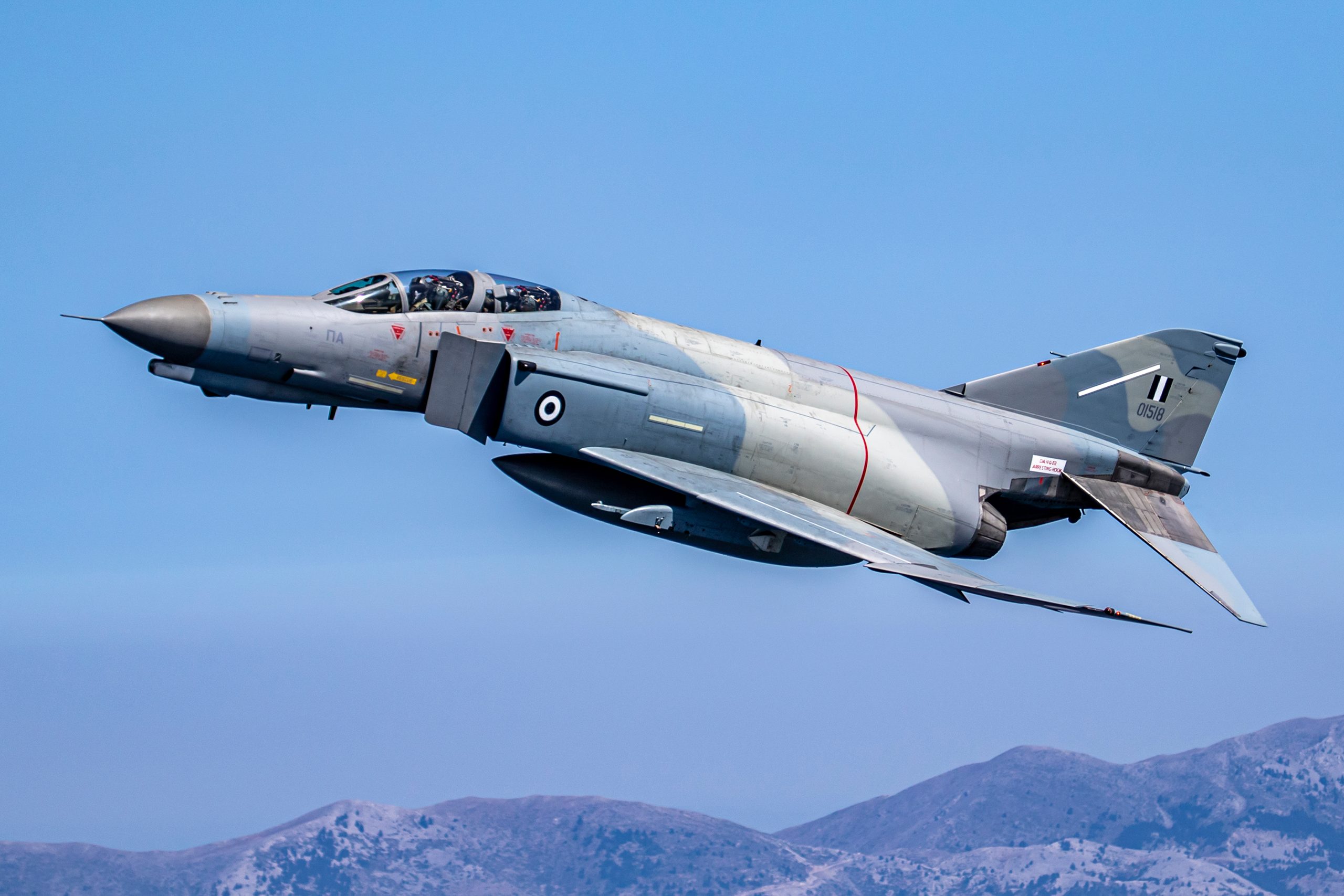 Hellenic F-4E AUP Phantom II 01518 climbing in side profile, air to air