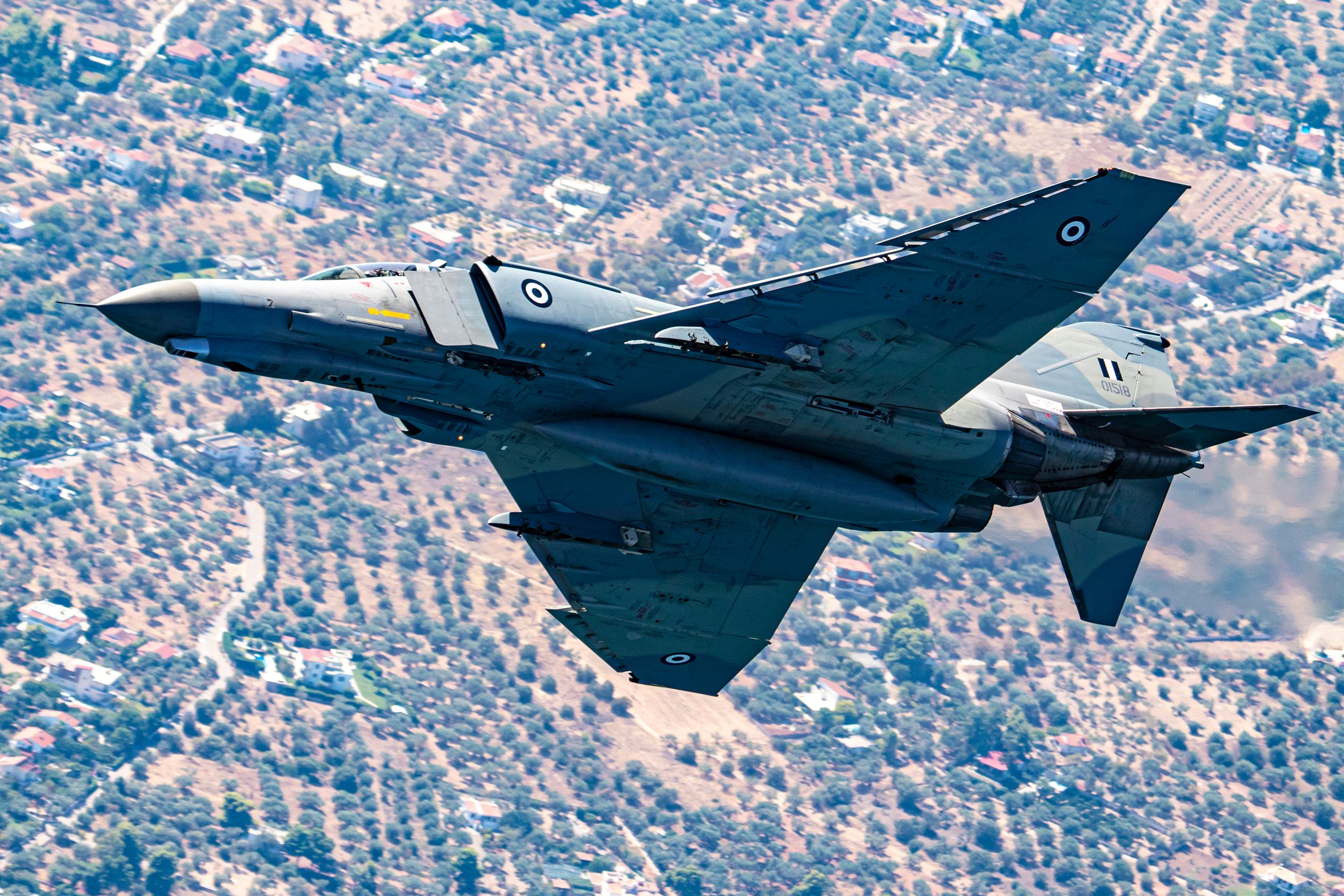 Hellenic F-4E AUP Phantom II topside over olive groves, air to air