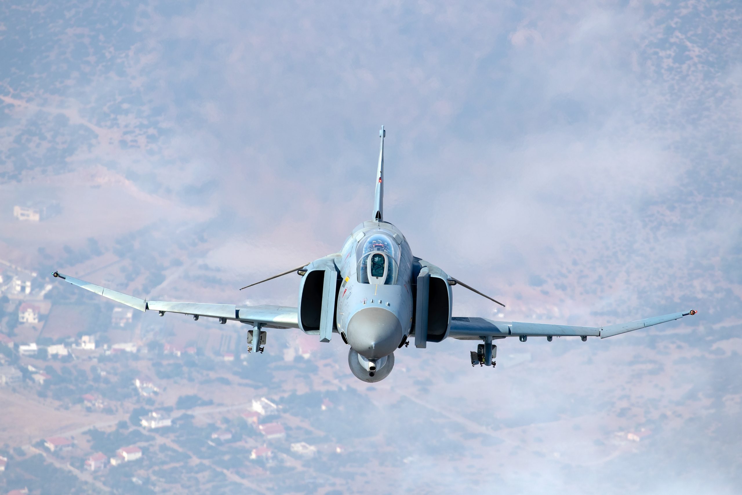 Hellenic F-4E AUP Phantom II 01518 head on over Greek hills, air to air