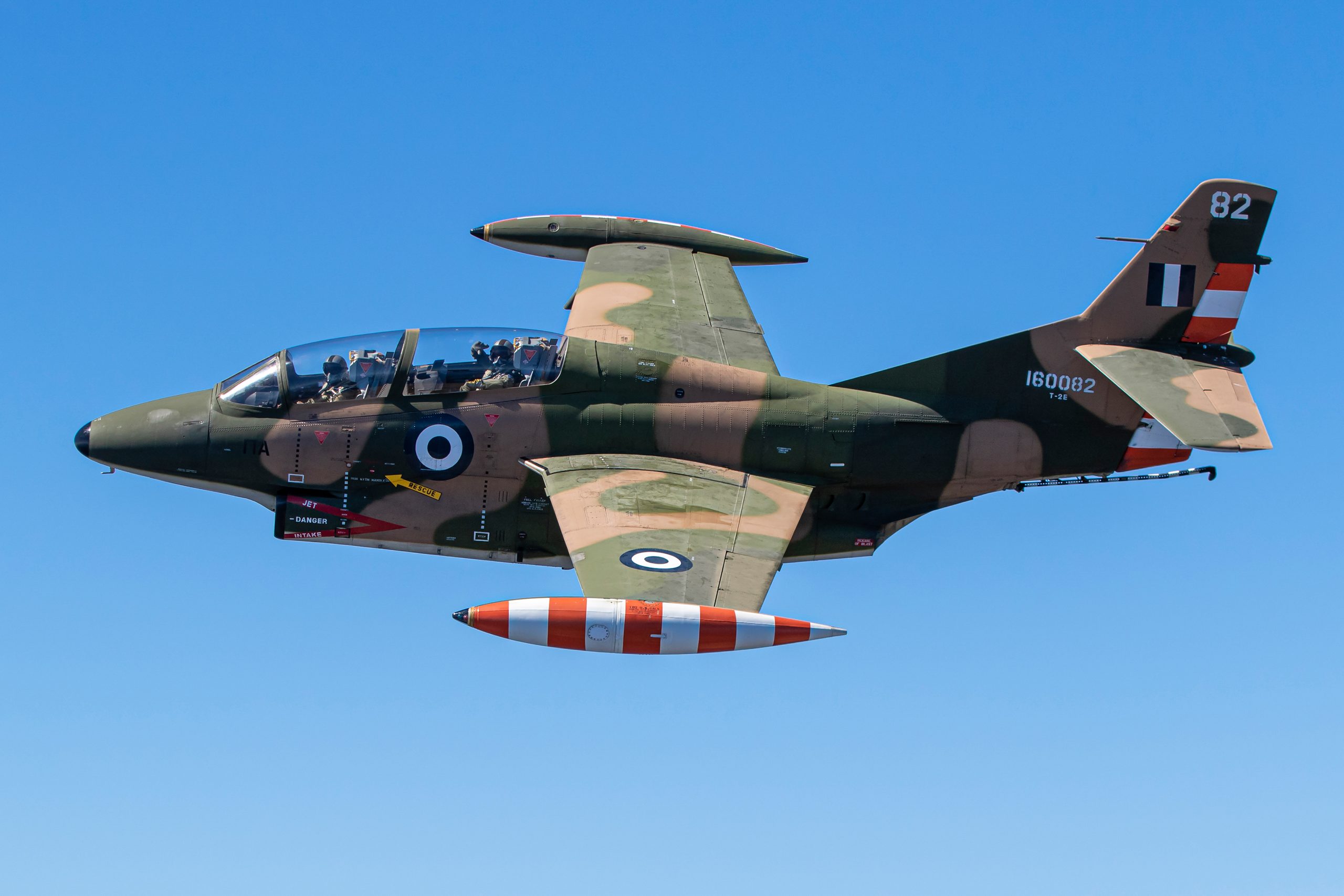 Camouflaged Hellenic Air Force T-2E Buckeye 160082 close up with practice pod, air to air
