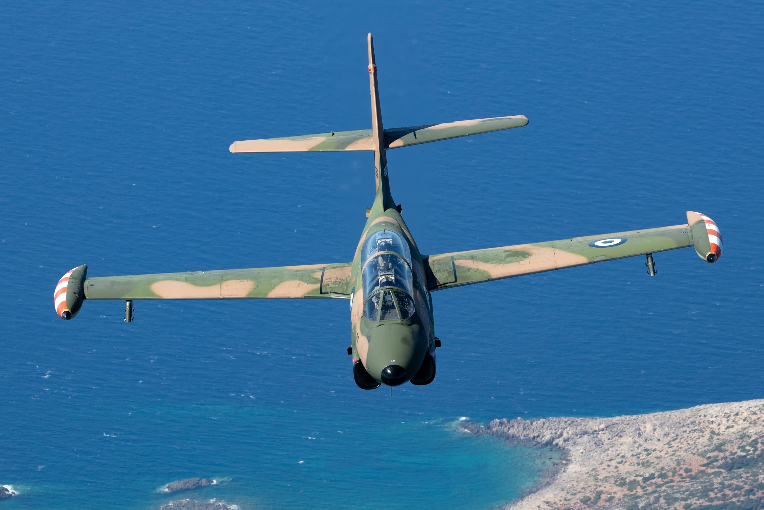 Hellenic Air Force T-2E Buckeye over the Greek coastline, air to air