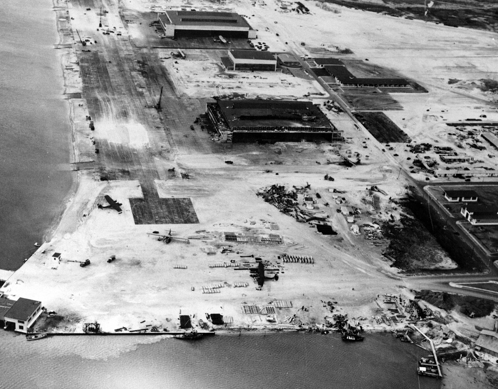 Aerial view of the burnt hangars and destroyed Catalinas at Naval Air Station Kaneohe Bay