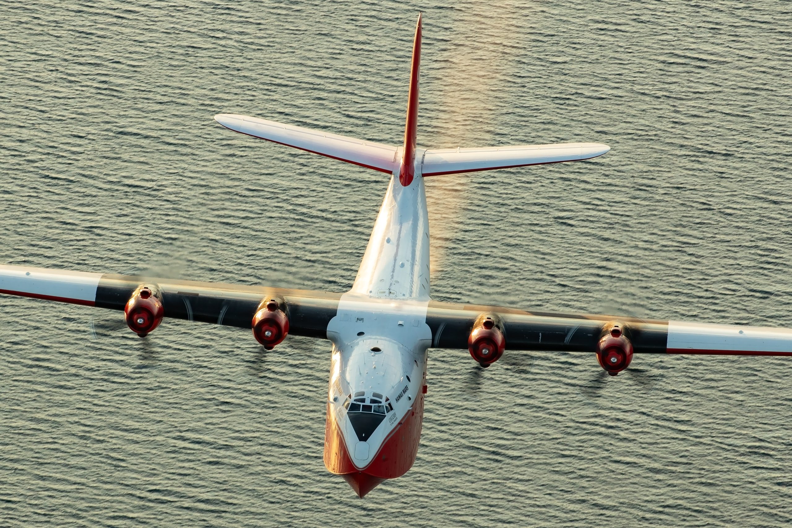Martin JRM Hawaii Mars head on over the water, air to air