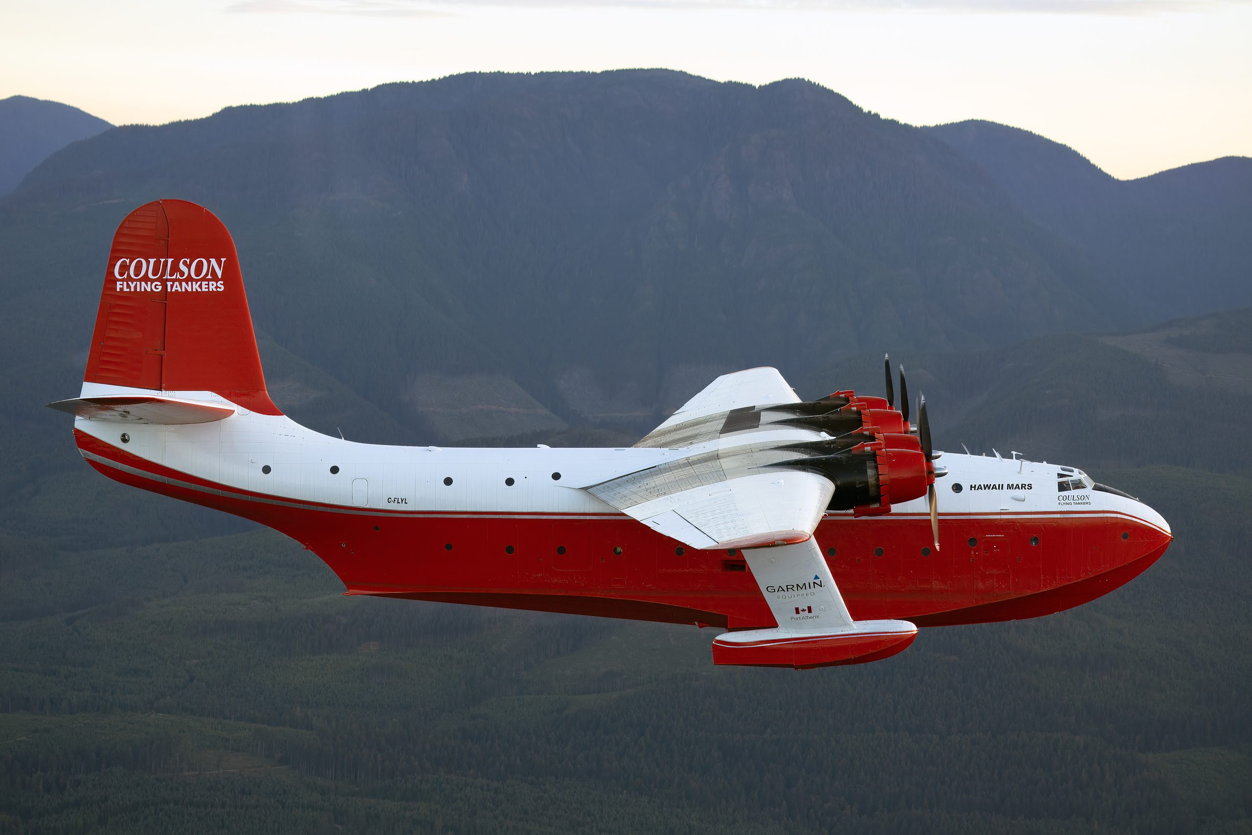 Martin JRM Hawaii Mars side profile against mountains at dusk, air to air