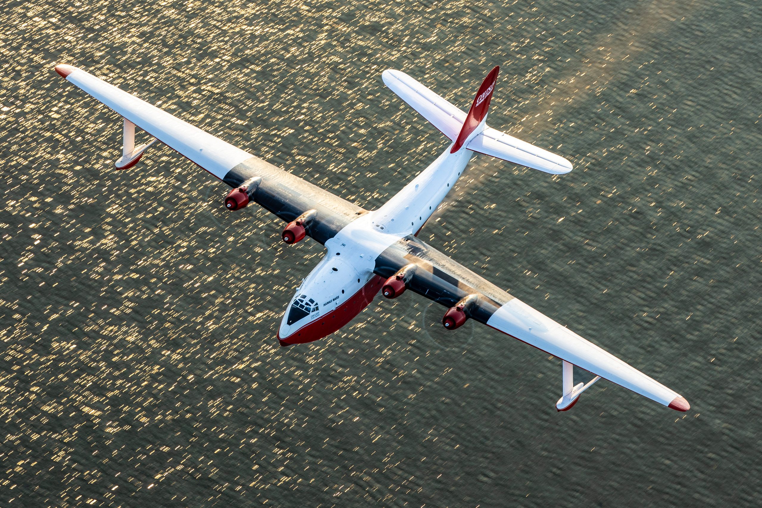 Martin JRM Hawaii Mars topside over sparkling sea, air to air