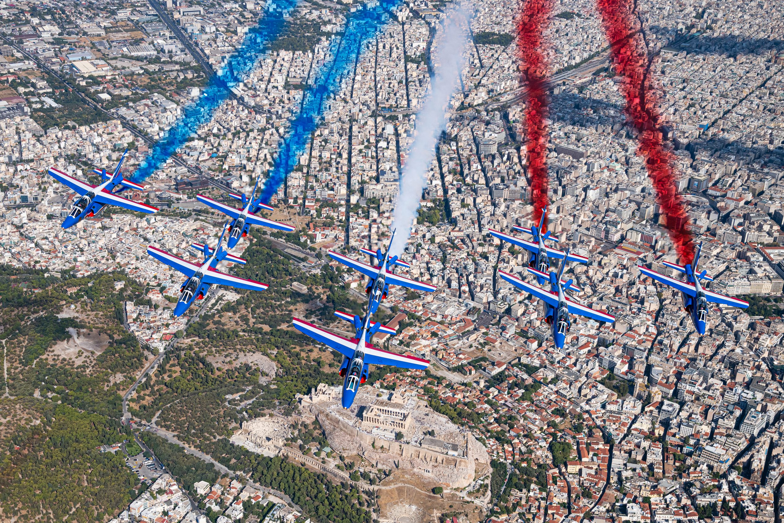 Patrouille de France Alpha Jets trailing tricolore smoke over Athens, air to air