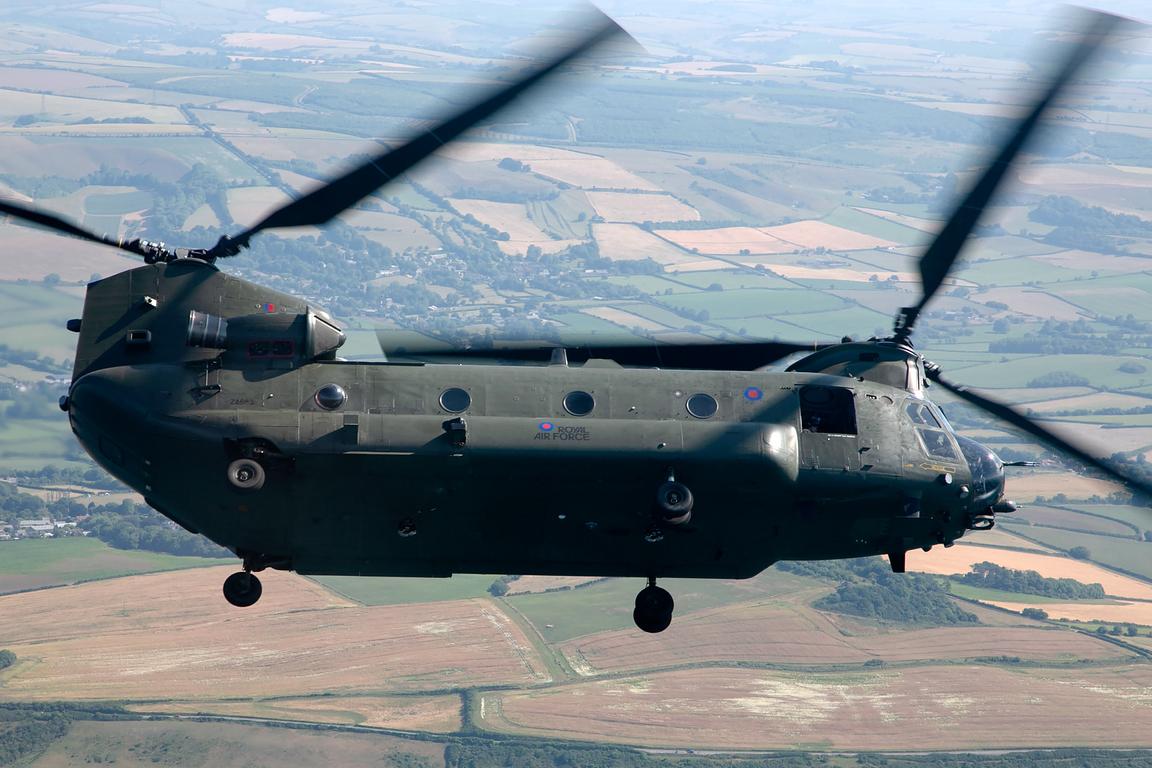 RAF Boeing Chinook HC6A ZA683 banking over farmland, air to air