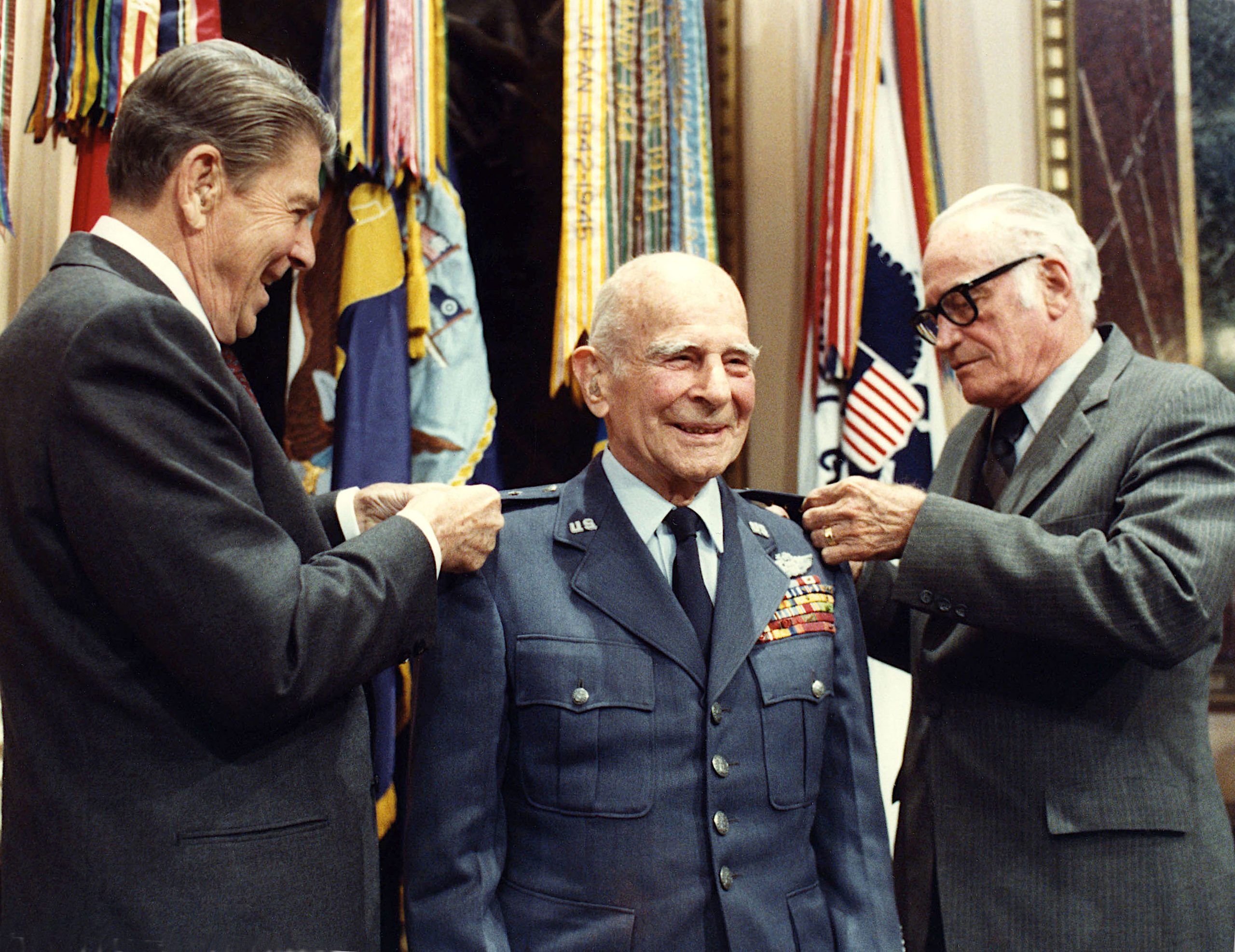 President Reagan and Senator Goldwater pin the fourth star on James Doolittle, 1985