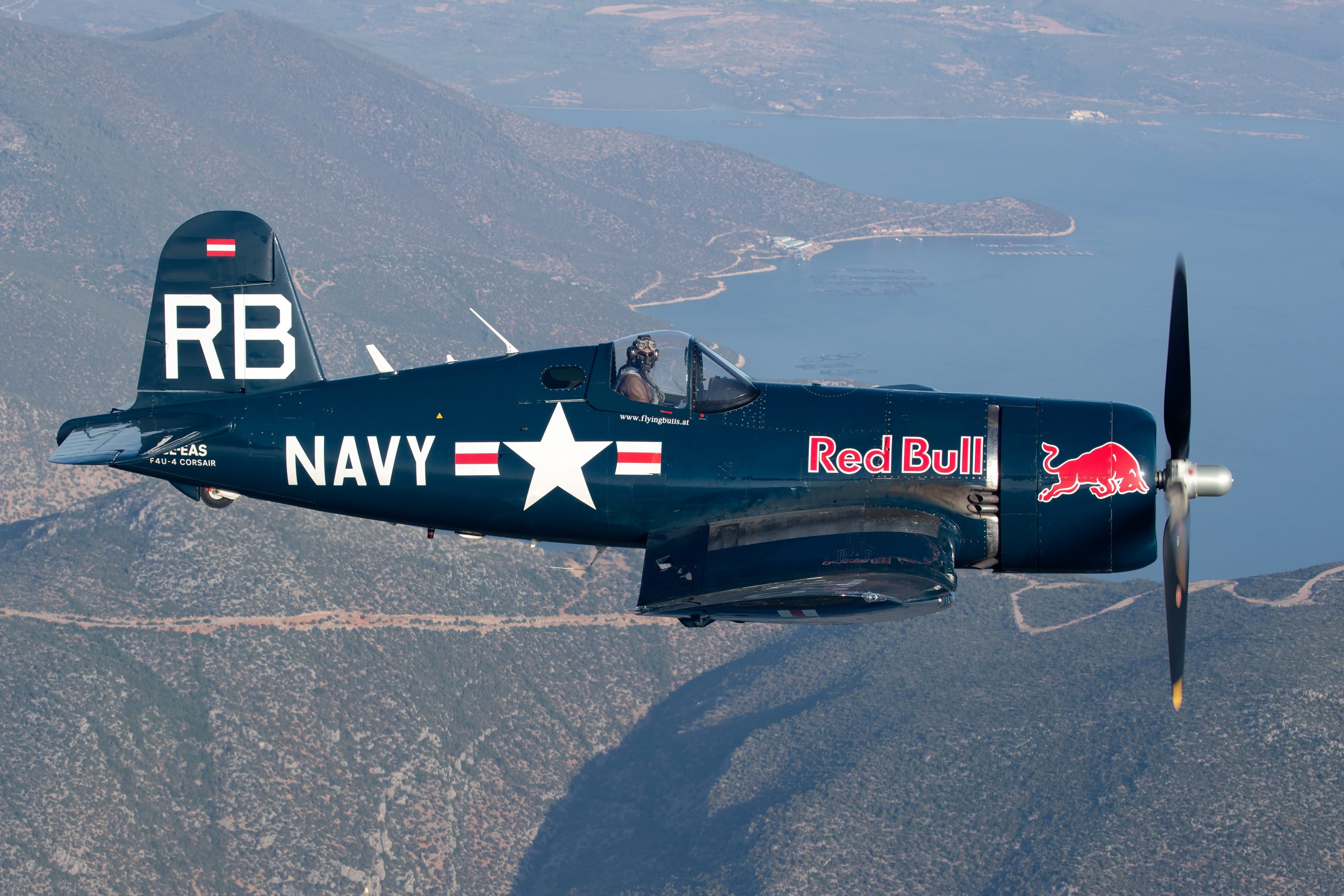The Flying Bulls Vought F4U-4 Corsair OE-EAS side profile over the Greek coast, air to air