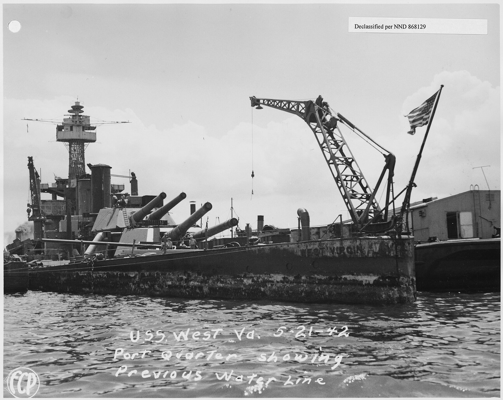 USS West Virginia refloated in 1942 with a band of marine growth marking her previous water line