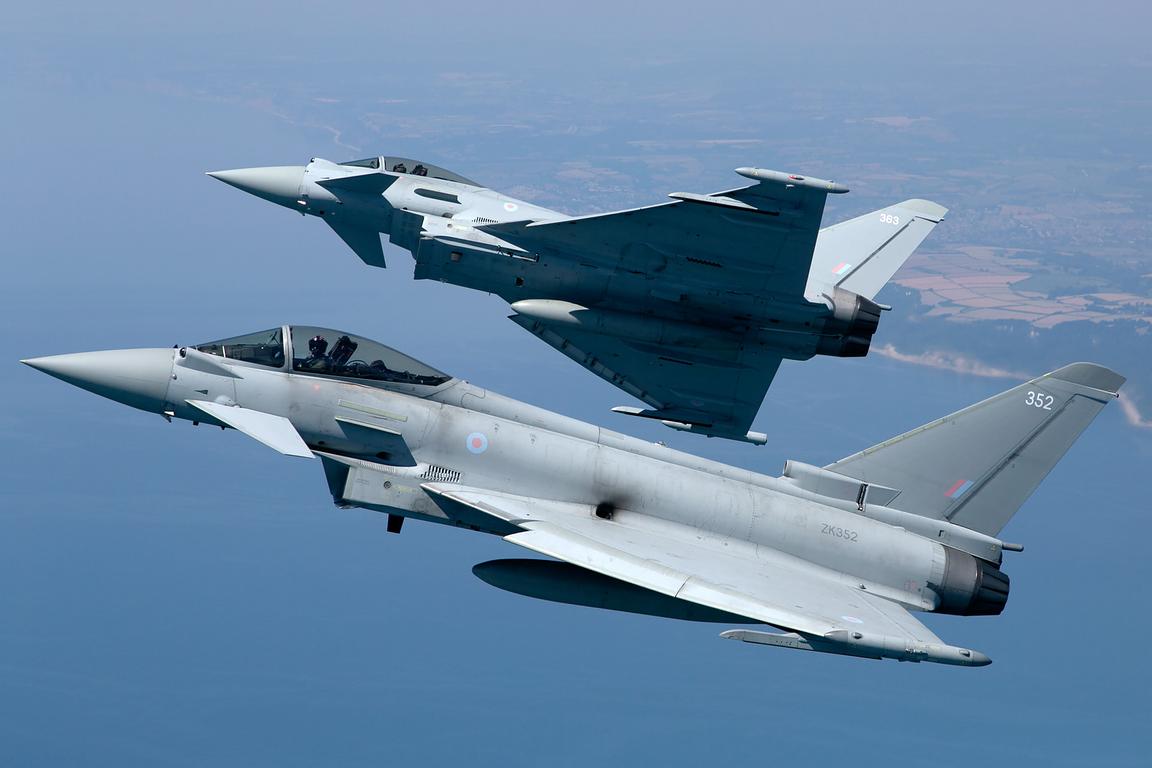 Two Typhoons in formation over the sea, air to air