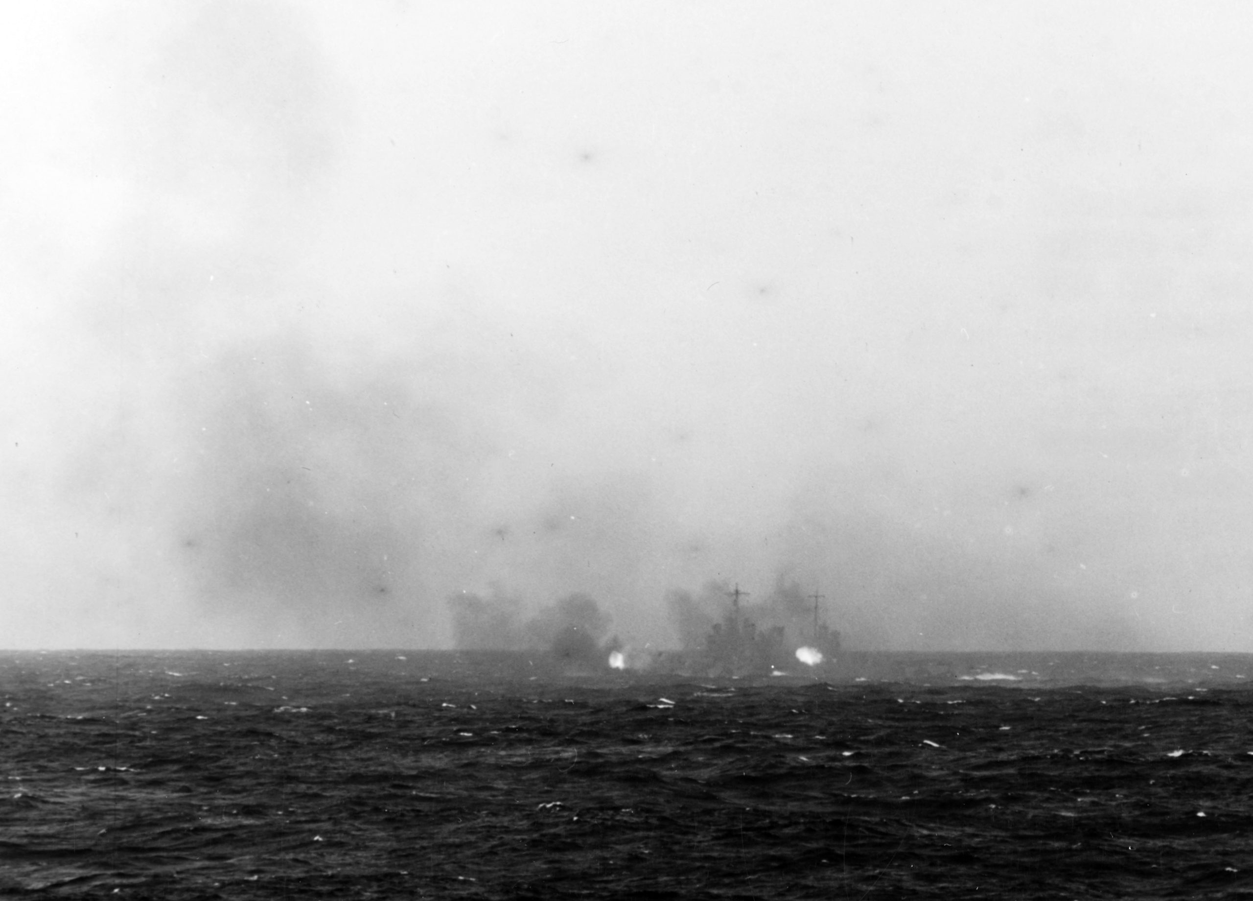 USS Nashville firing on a Japanese picket boat, 18 April 1942