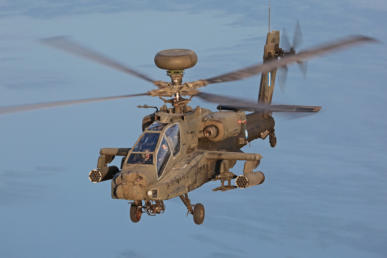 A Boeing AH-64DHA Apache Longbow of the Hellenic Army head on in flight, the drum-shaped Longbow radar carried above the rotor
