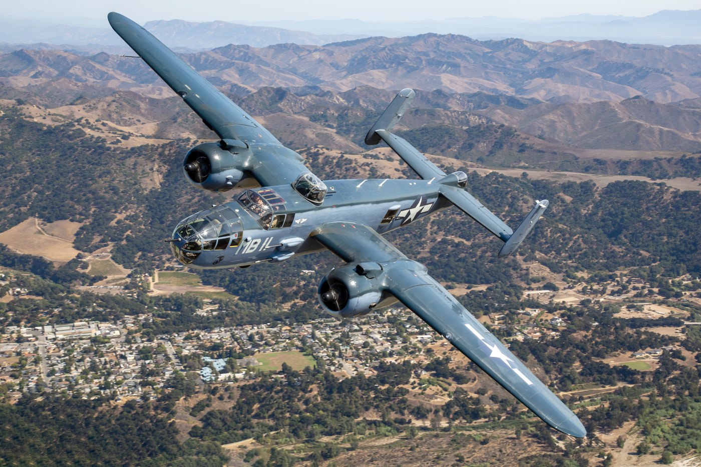 PBJ-1J Mitchell N5865V banking over southern California, showing the national star on the underside of the port wing