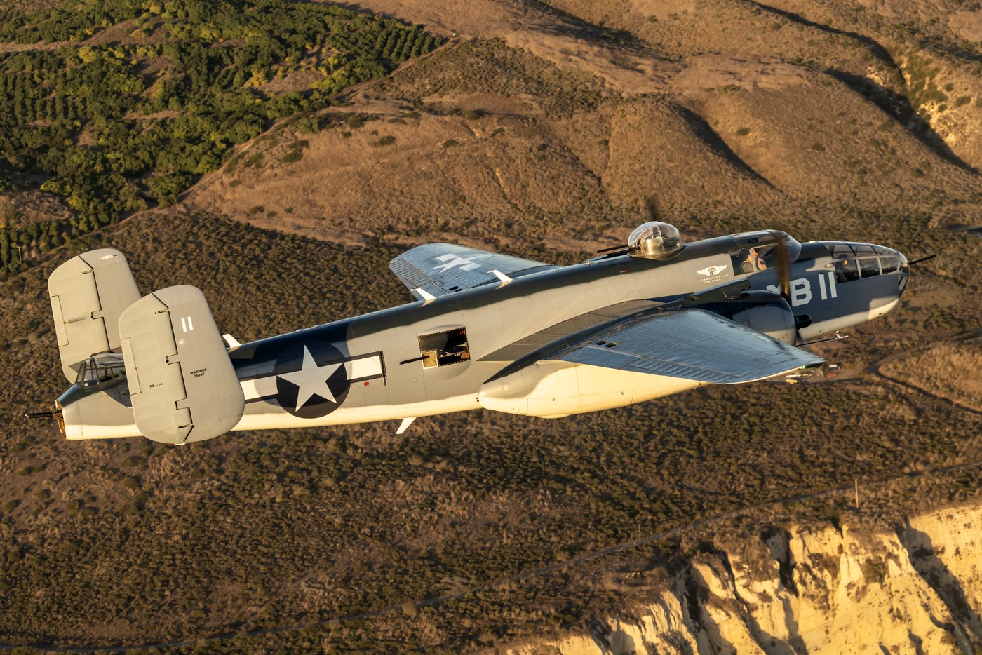 PBJ-1J Mitchell N5865V from above with the waist window open and a machine gun in the aperture