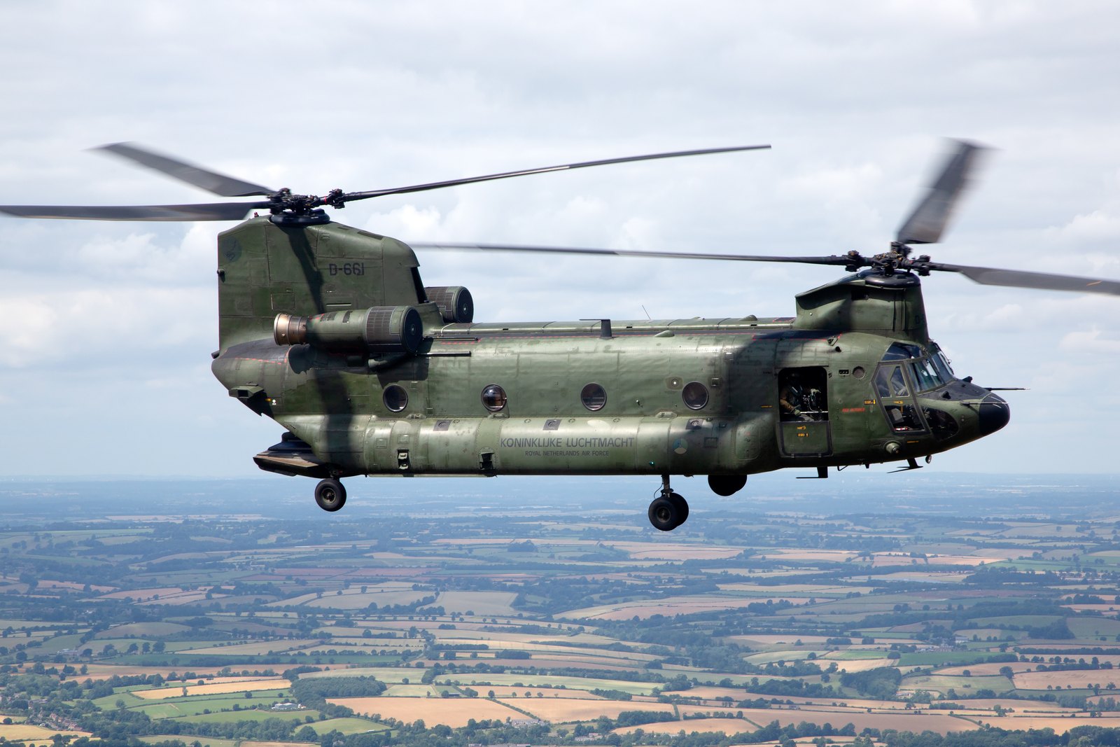 A Royal Netherlands Air Force Boeing CH-47D Chinook in full side profile, showing the tandem rotor layout and the engines beside the rear pylon