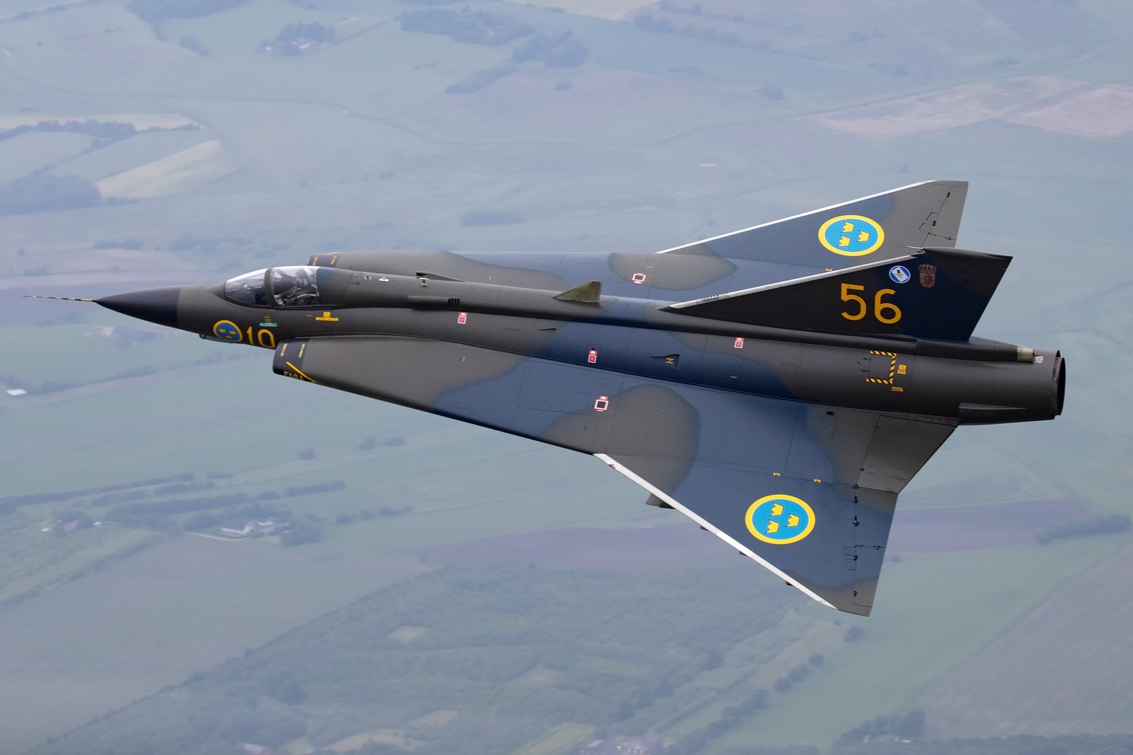 A Saab J35J Draken of the Swedish Air Force Historic Flight in splinter camouflage, seen from directly above, showing the double delta wing