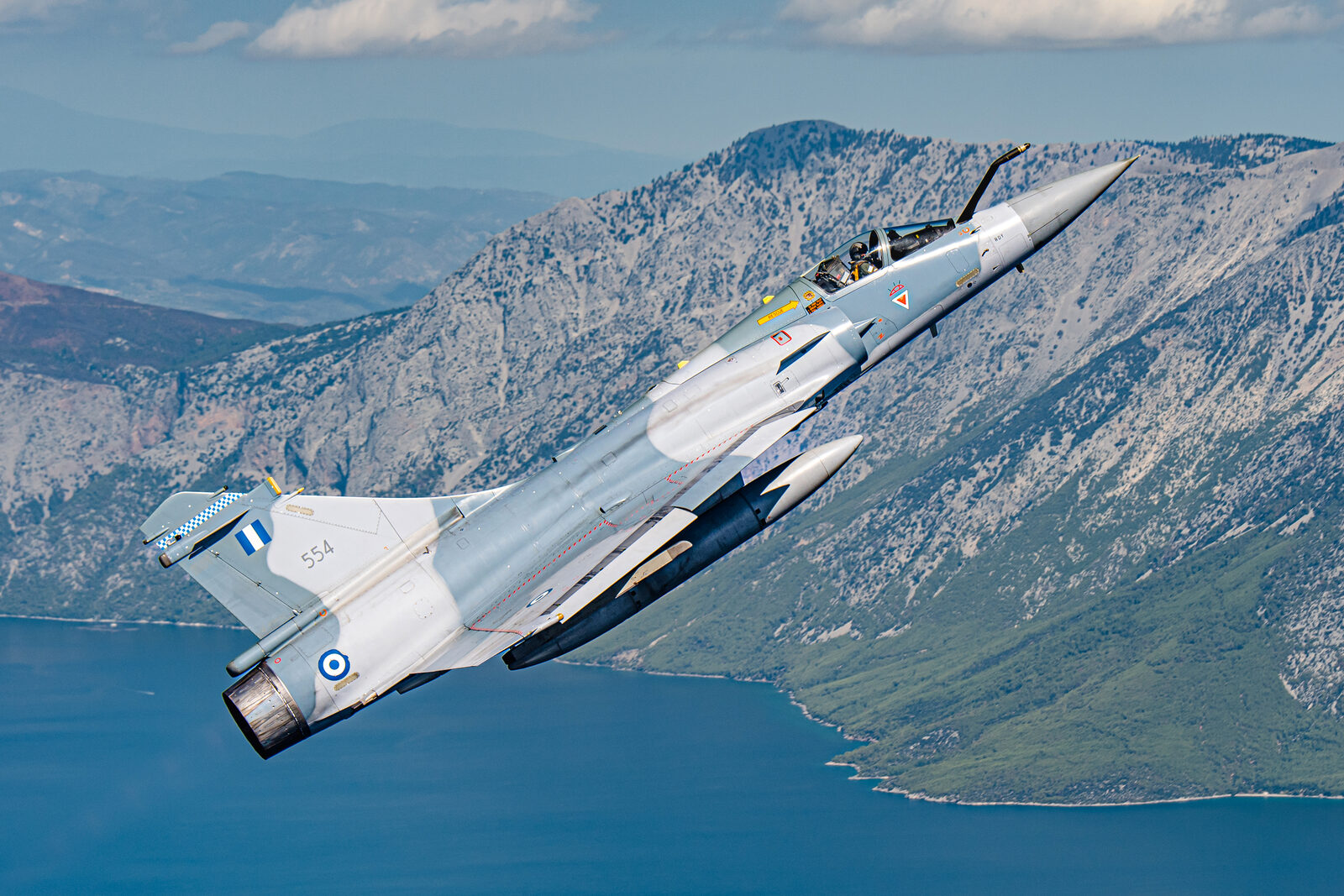 Hellenic Air Force Dassault Mirage 2000-5EG serial 554 climbing steeply past a mountain ridge