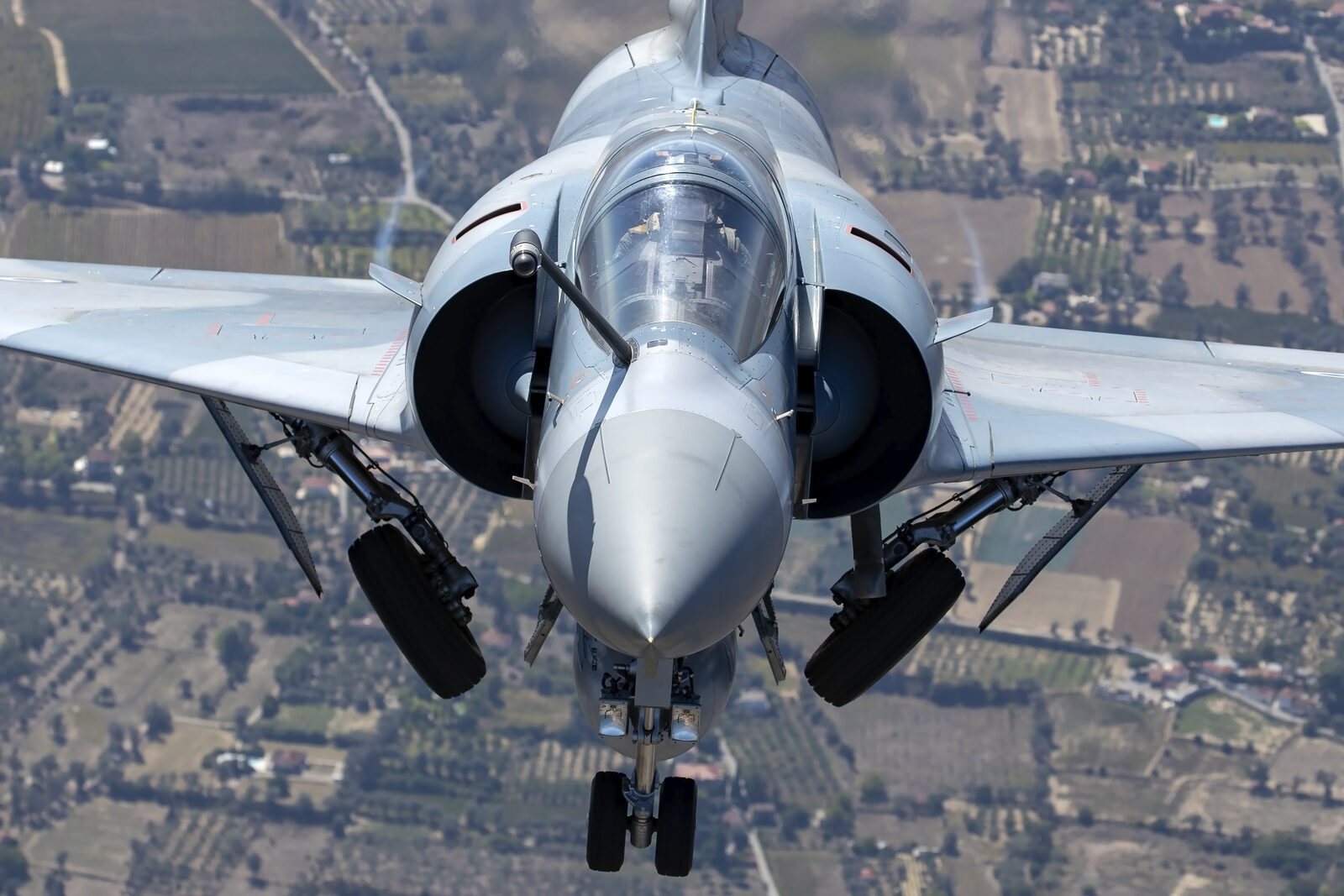 Head-on view of a Hellenic Air Force Dassault Mirage 2000-5EG with its undercarriage down over Greek farmland