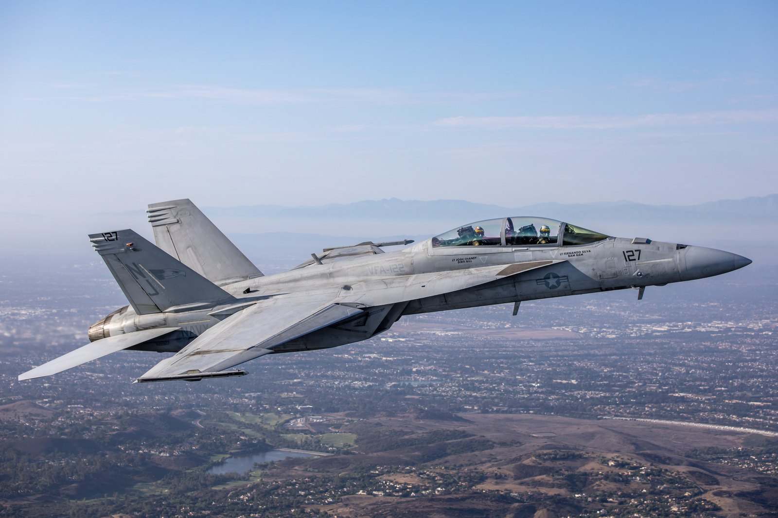 A United States Navy Boeing F/A-18F Super Hornet of VFA-122 in full side profile, showing the rectangular raked engine intake